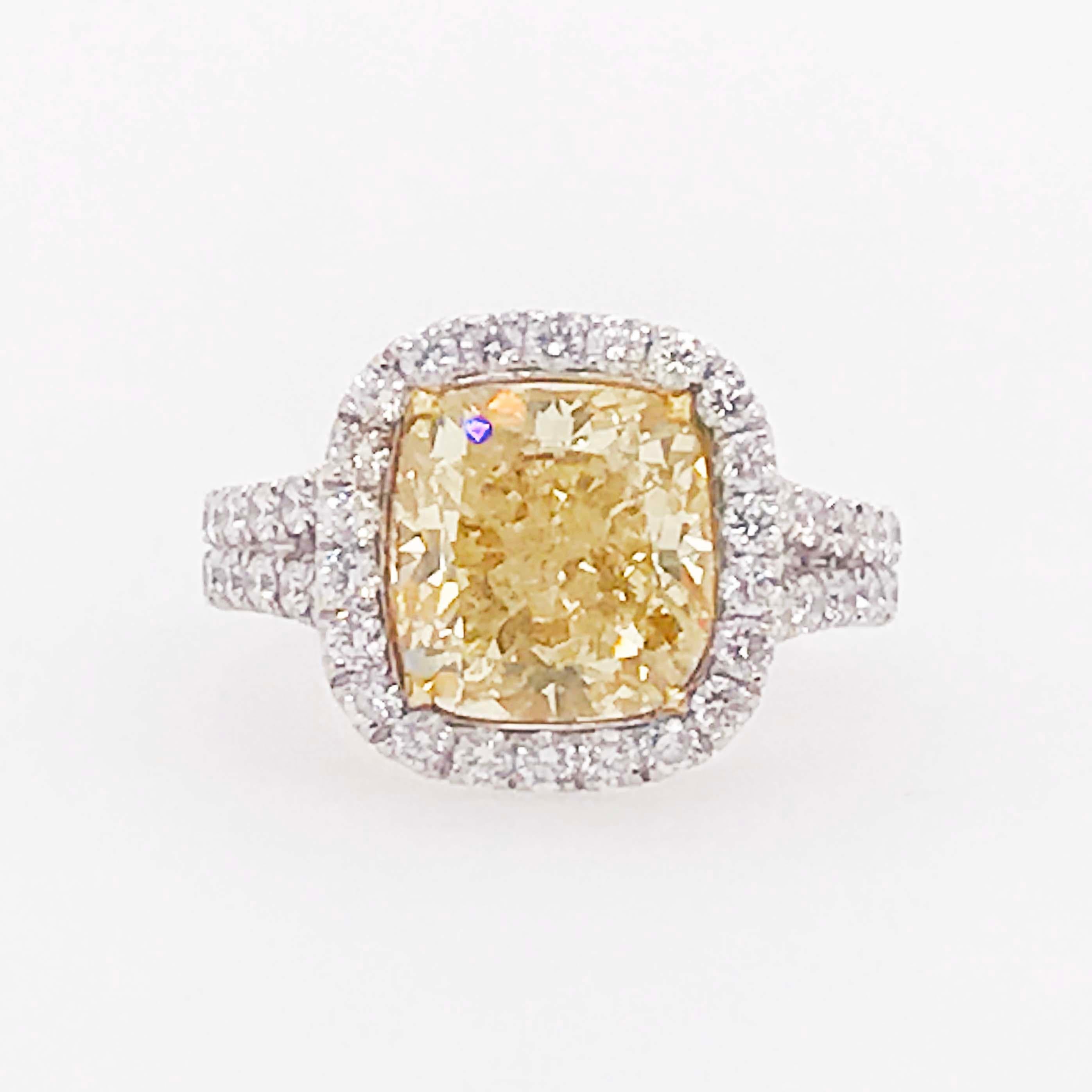 Modern Certified 4 Carat Fancy Yellow Diamond and White Diamond Halo 18 Karat Ring