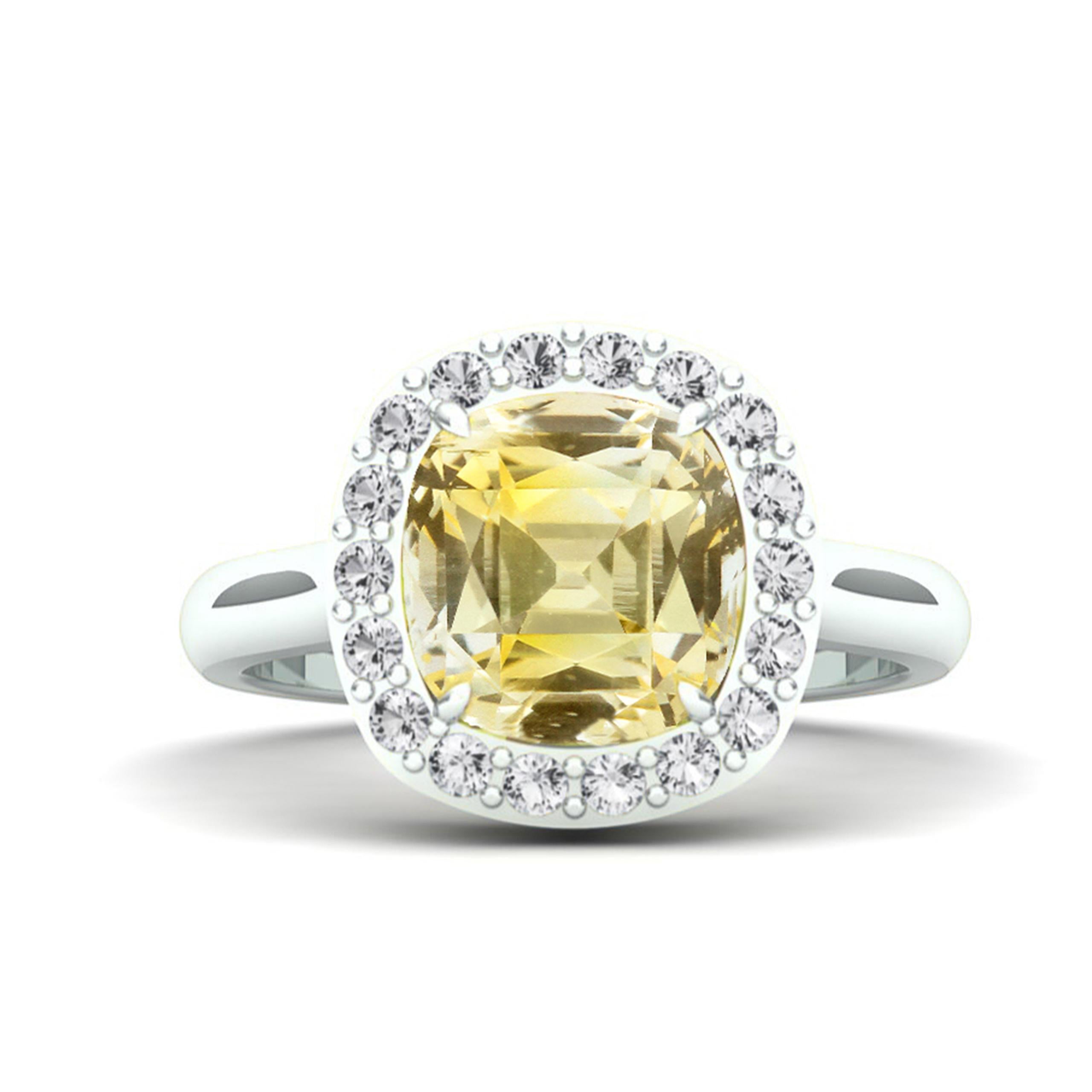 Step into a world of sophistication with our 4 carat Natural & Unheated Yellow Sapphire ring, a union of exquisite design and unparalleled craftsmanship. 

At the heart of this enchanting piece is a 4.01-carat natural untreated Ceylon Yellow