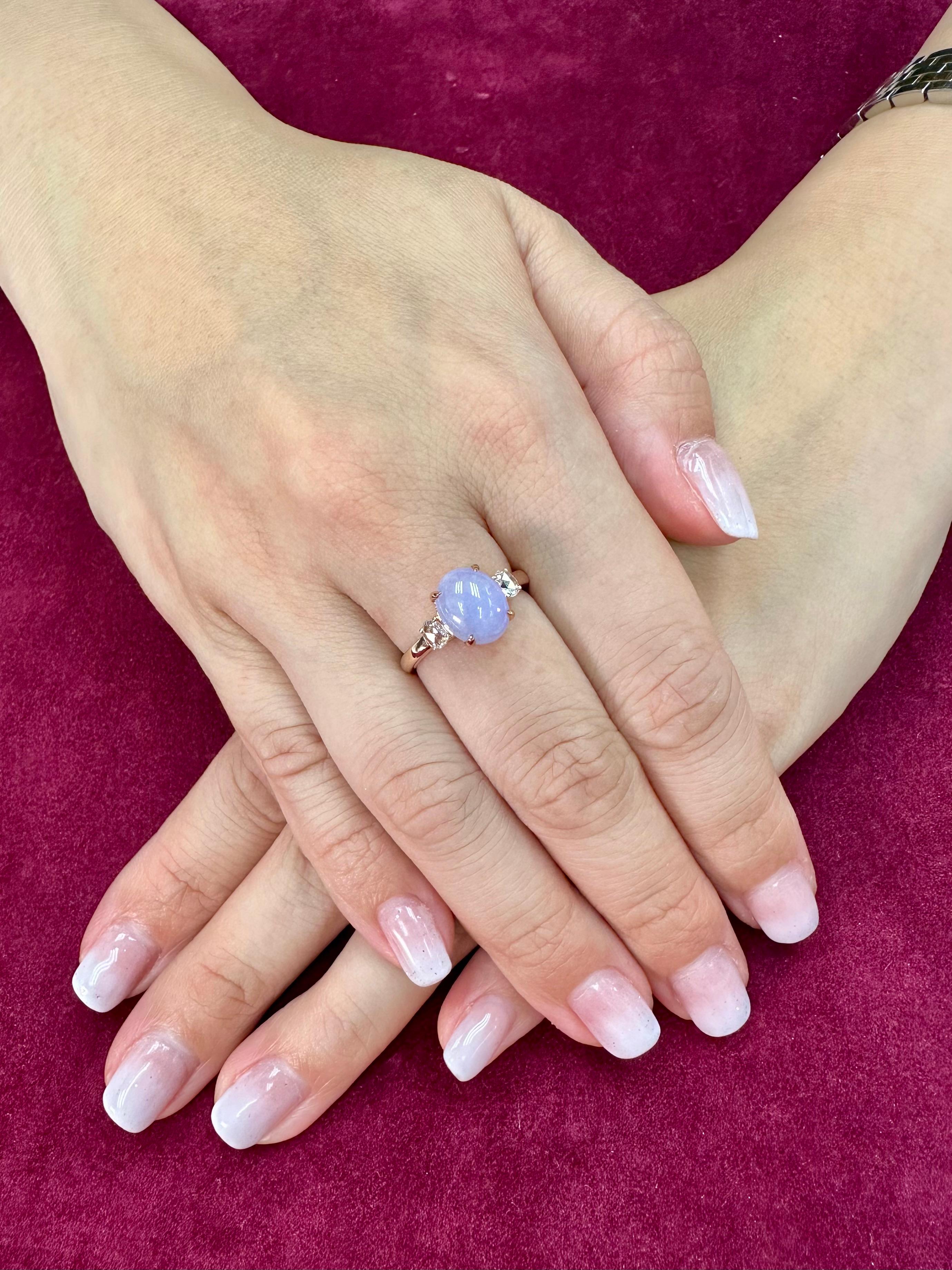 Please check out the HD Video! Here is a very eye pleasing lavender jade and diamond 3 stone ring! It is certified natural jadeite jade. The ring is set in 18k rose gold and diamonds. There are 2 new rose cut diamonds that on each side of the jade