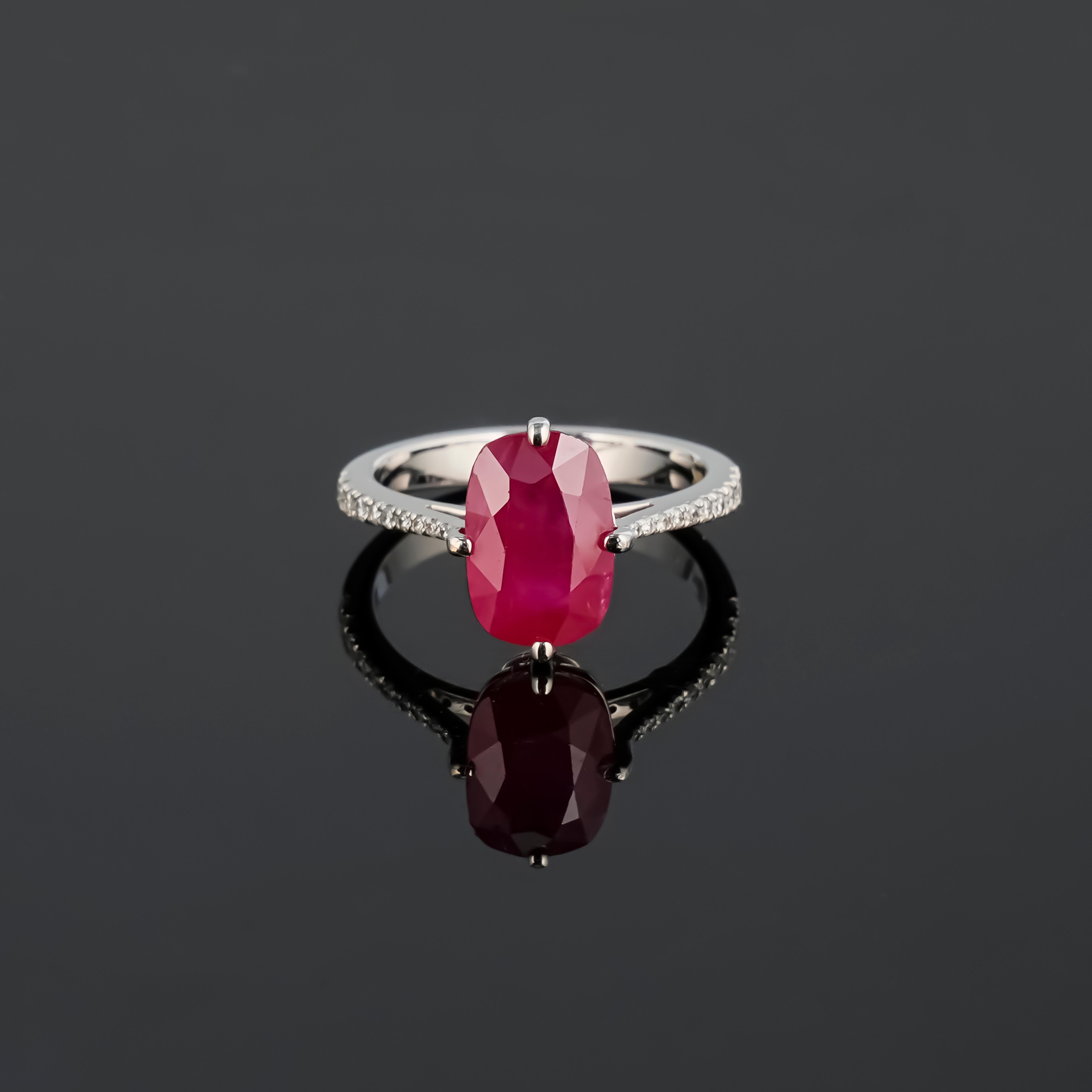 A beautiful certified 4.06 carat Burmese Ruby and Diamond engagement ring, set in solid 18K White Gold. The ring is currently sized at US size 7, can be resized. The center stone has a stunning, vivd red color and a unique elongated oval shape.
We