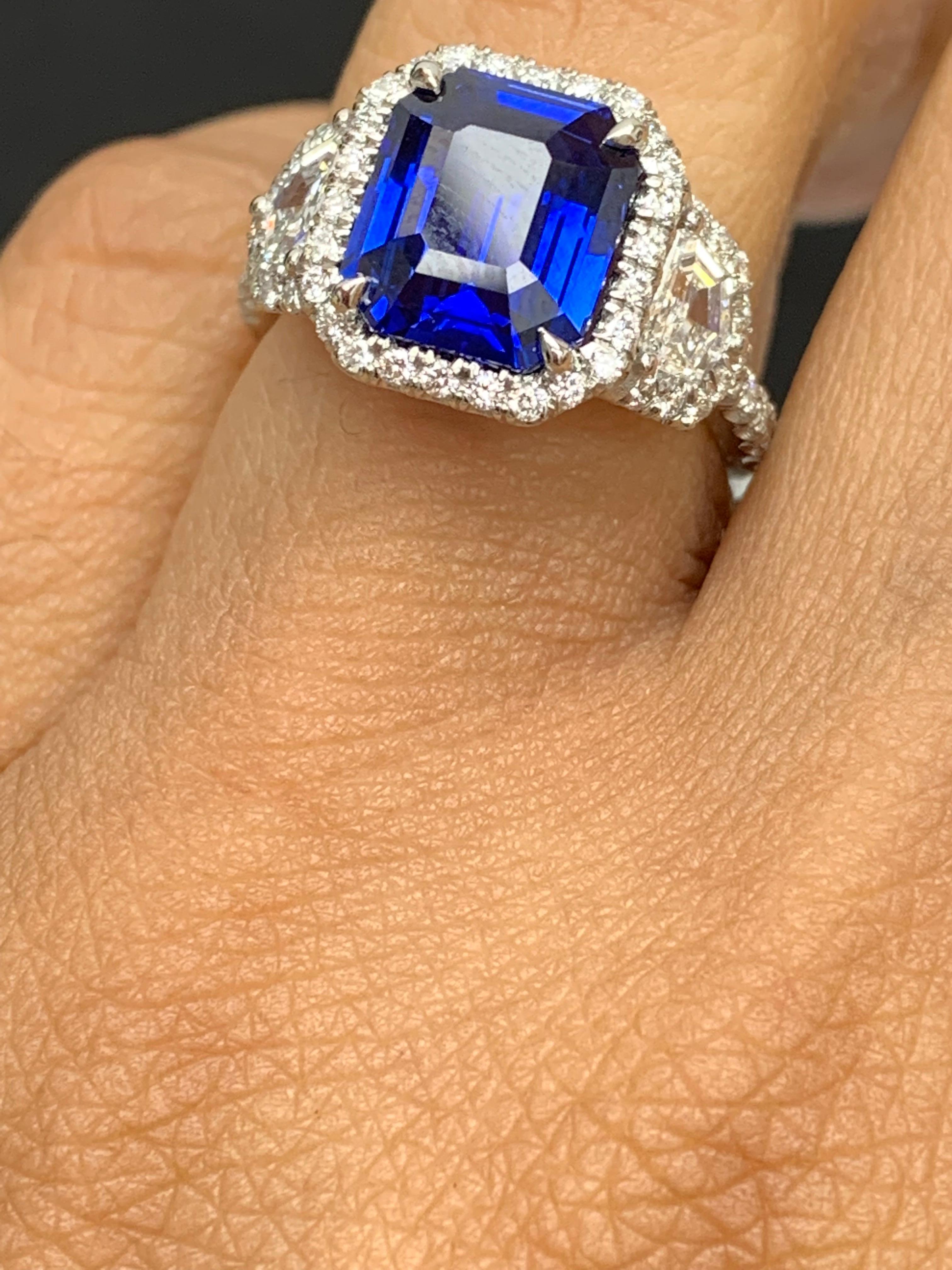 Modern Certified 4.07 Carat Emerald Cut Sapphire Diamond 3 Stone Halo Ring in Platinum For Sale