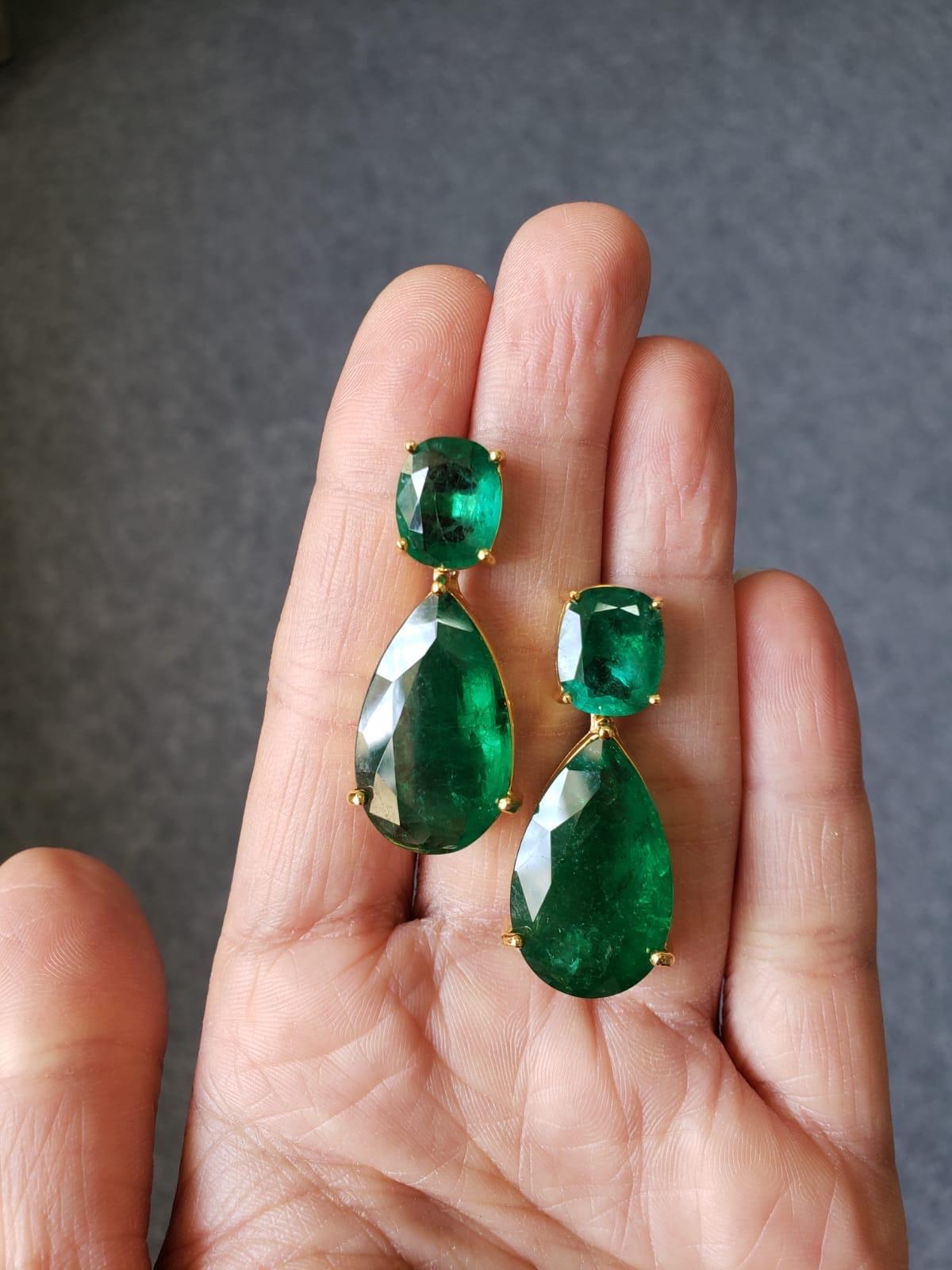A stunning pair of 33.14 Carat , lustrous, transparent natural Zambian Emerald Pear Shapes with 8.00 Carat Cushion Shapes studs, with a push and pull backing. These beautiful emeralds have no chemical / dye, are absolutely natural - and they are set