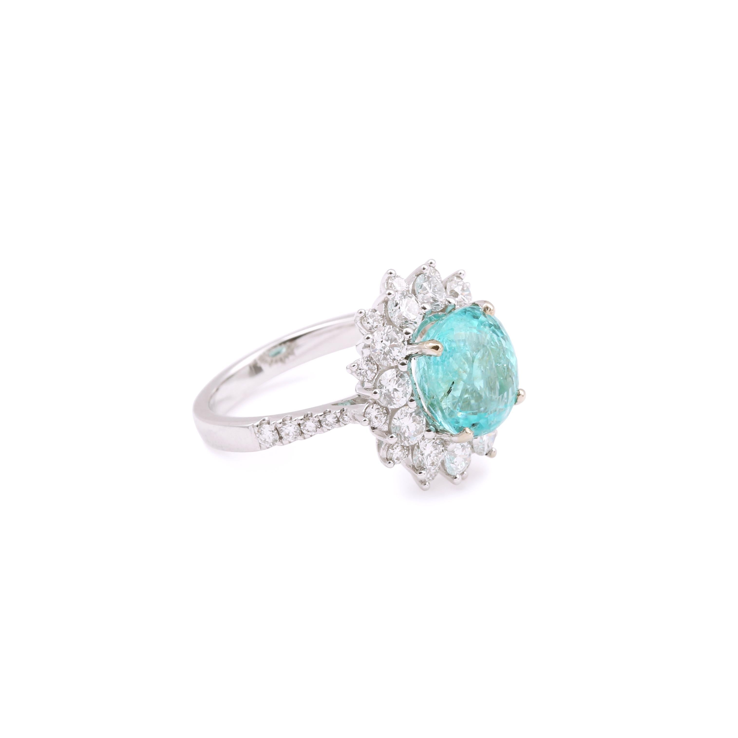 Exceptional ring in 18 carats white gold set with a magnificent cushion-cut Paraiba tourmaline and surrounded by brilliant-cut diamonds.

Tourmaline certified by the Carat Gem Lab.

Ring dimensions: 16.59 x 15.47 x 8.78 mm (0.653 x 0.609 x 0.345