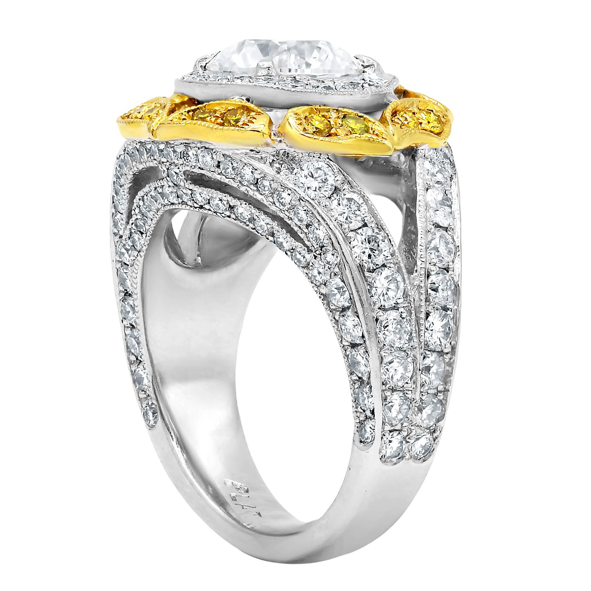One of a kind EGL certified diamond engagement ring with round brilliant cut diamond in the center,weighing 2.00 carats G color/Si1 clarity set in custom made halo mounting and accented by 2.35 TCW white and yellow  round cut diamonds on the side