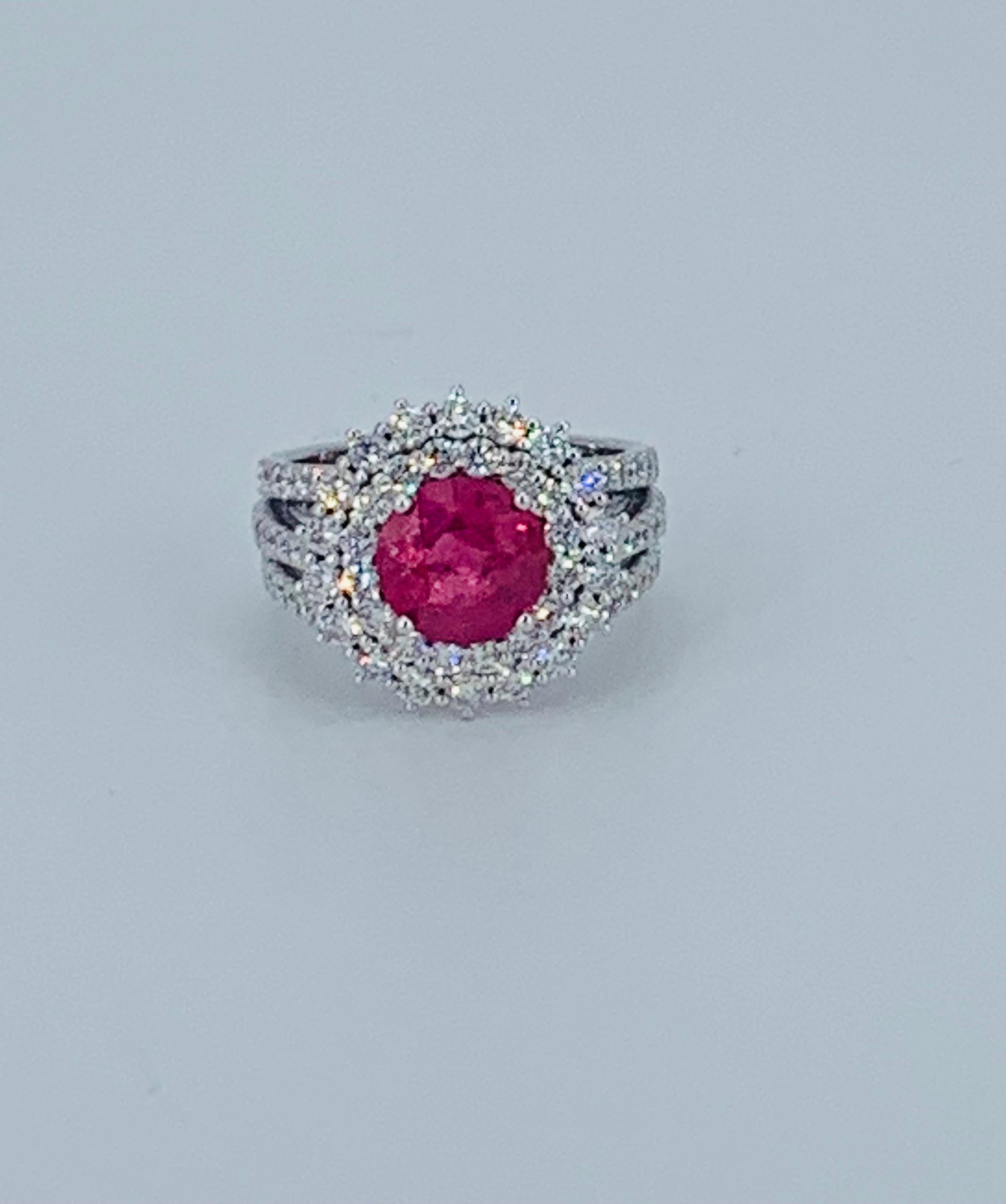 This beautifully bright Ruby and Diamond Halo cocktail ring is truly gorgeous. Nestled amongst multiple  Diamonds the natural Ruby is placed in the centre. 

The bright white natural Diamonds compliment the precious jewel and add extra beauty to the