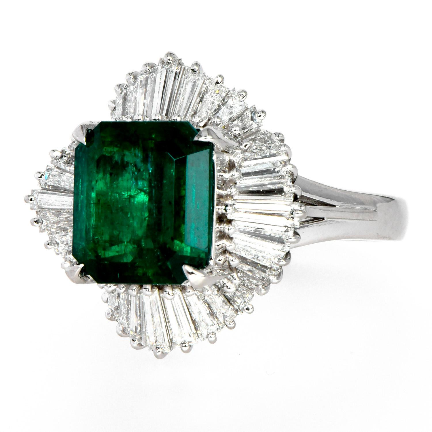 Exquisite ballerina style cocktail ring, with a sparkly ballerina & old mine Emerald.

Crafted in solid Platinum, the center is adorned by a GRS Certified vividly green color-saturated, old mine very fine Muzo Colombian emerald. Colombian