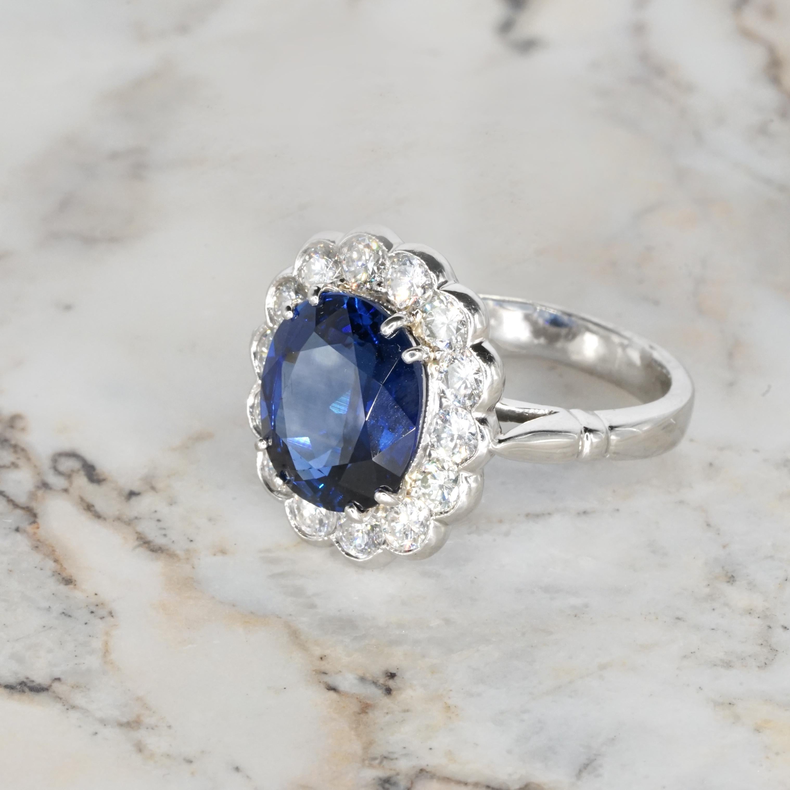 Contemporary Certified 5 Carat Blue Oval Shape Sapphire Diamond Halo Platinum Cocktail Ring For Sale