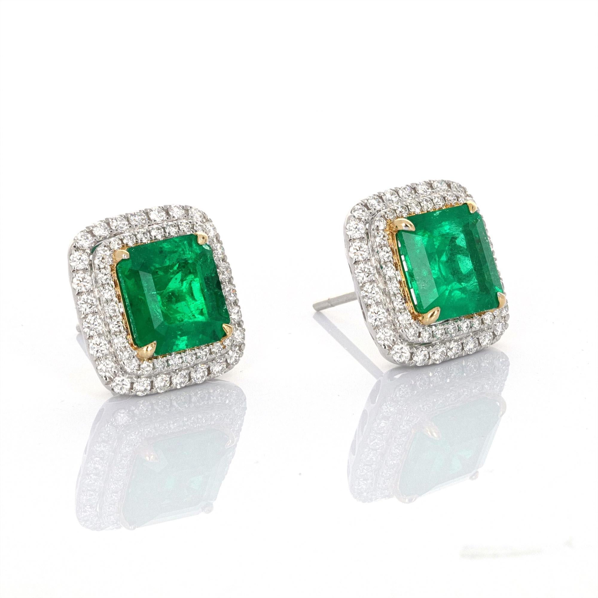5 carat total weight certified columbian minor emerald and diamond stud earrings. The center emeralds are certified by CDC. The emeralds are columbian, weigh 2.45 carats and 2.56 carats and have minor indications of heating. The color of these