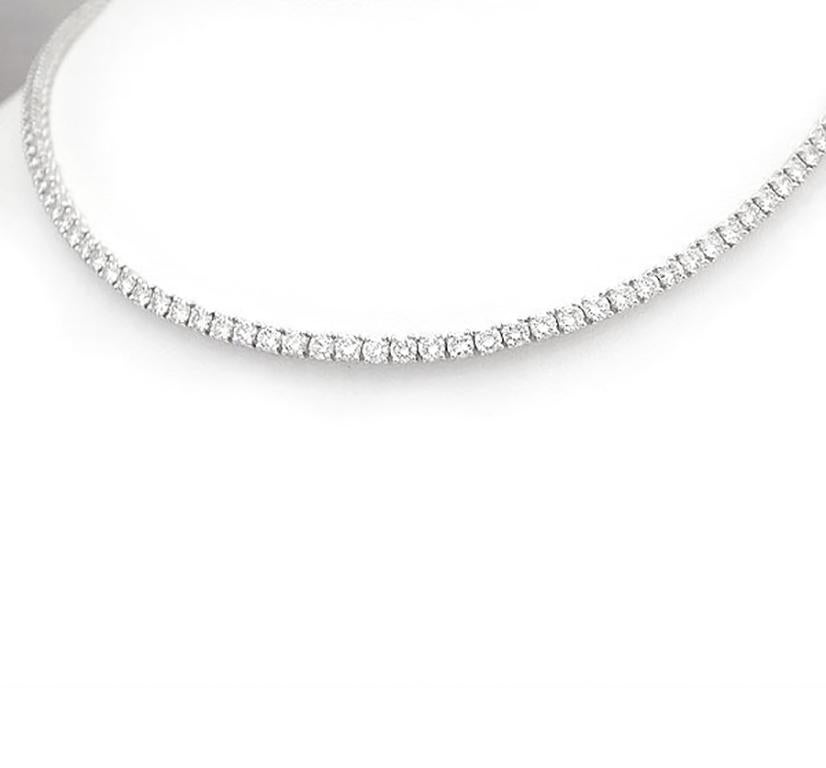 Classic 6.00 Carat Round Diamond 18'' Tennis Necklace in 14K White Gold. Certified by IGI Laboratory in New York, with full diamond jewelry grading report.

6.00 Carats of Round White VS-SI Diamonds
and 17.00 grams of 14K White Gold.

This is a
