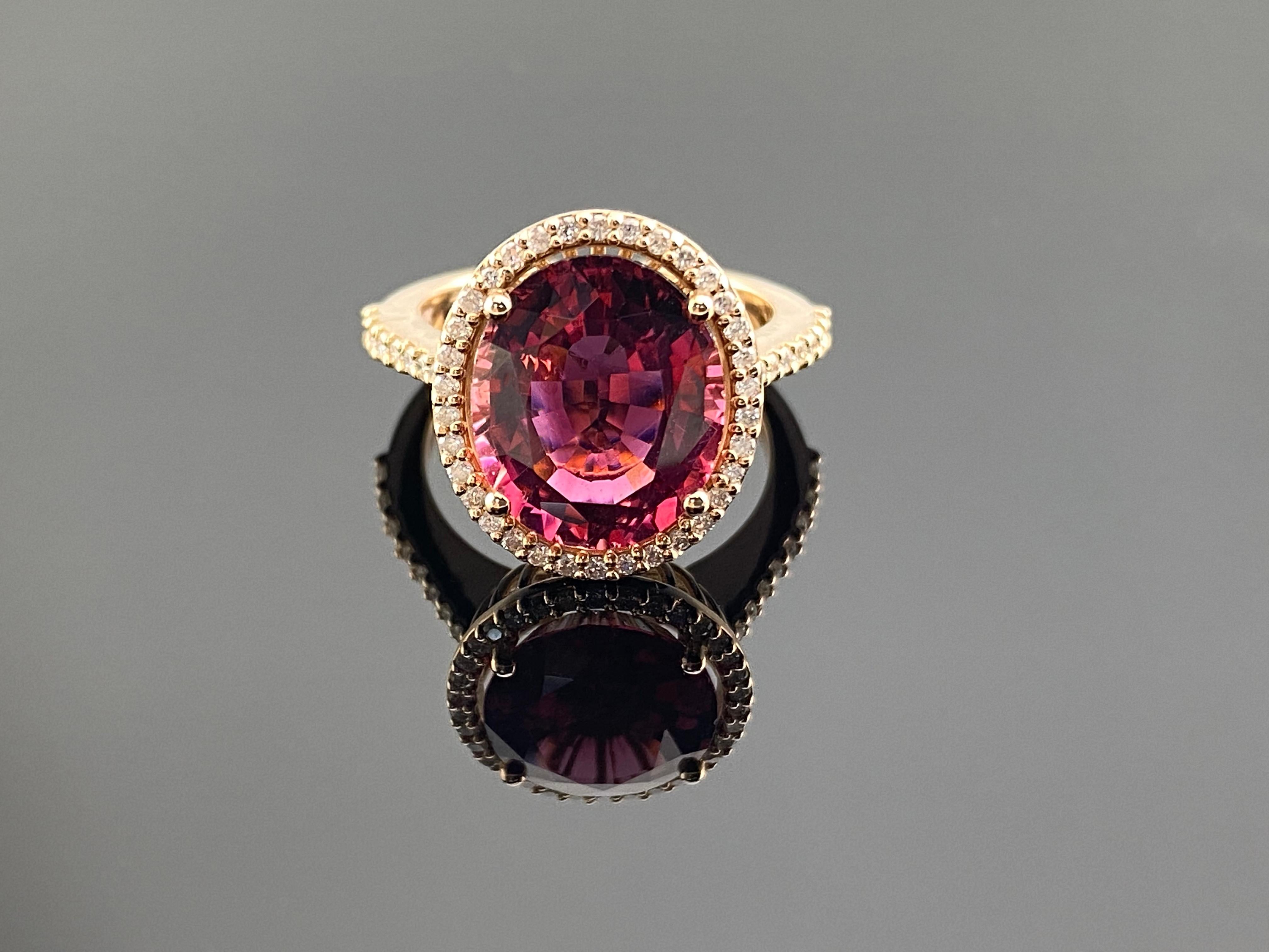Make a glamorous entrance with this custom made 18k rose/pink gold vintage-influenced ring, artistically crafted in a brightly polished shine. A large 5.03 carat pink rubellite nestles in a secure prong setting in the center. Sparkling round