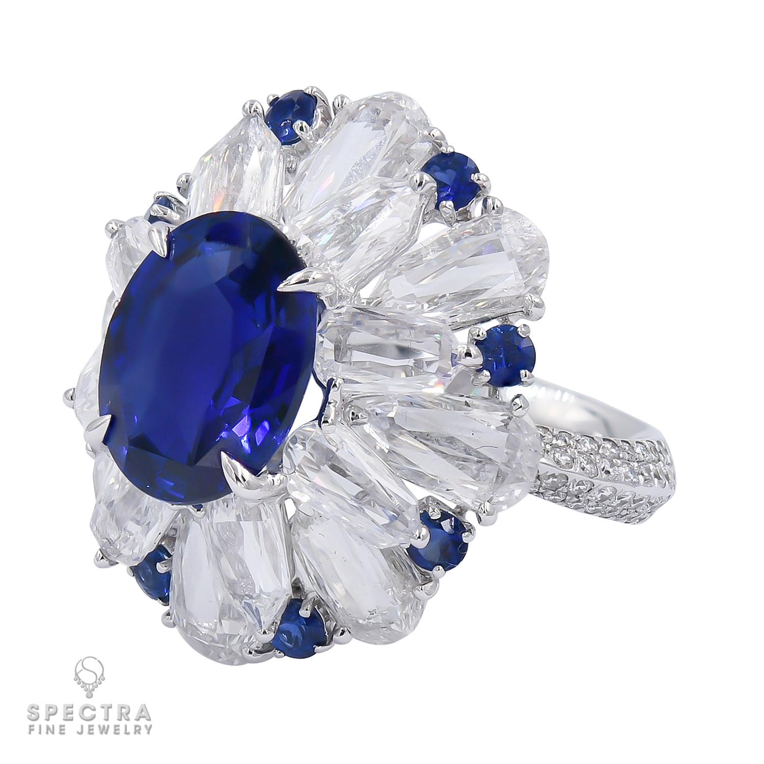 A stunning cocktail ring featuring 5.11 carat oval blue sapphire and diamonds mounted in 18K white gold.
The sapphire is certified by SSEF (Swiss Gemological Institute), stating that it has no indication of heating.
16 round diamonds weighing 6.94