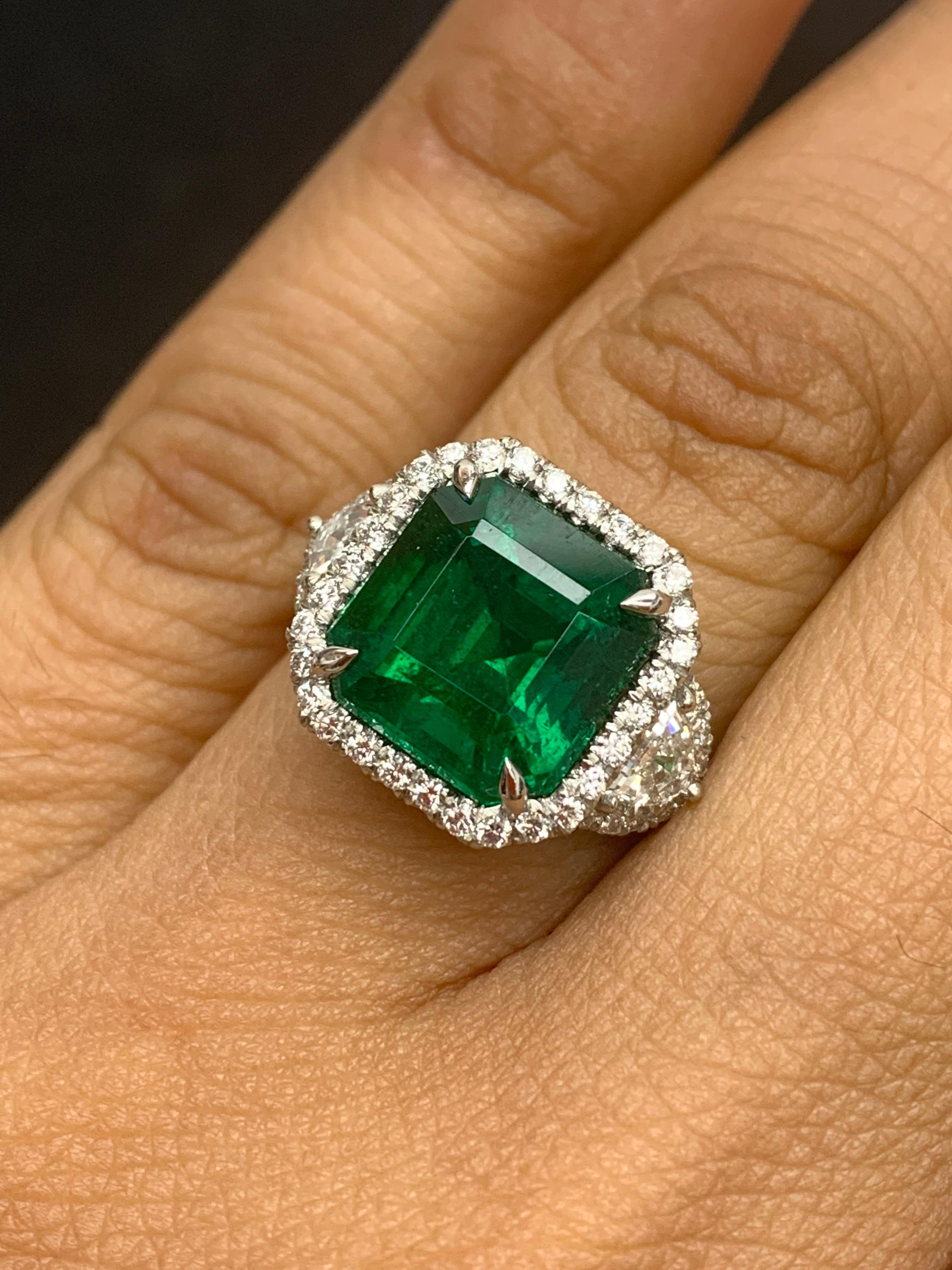 Modern Certified 5.23 Carat Emerald Cut Emerald Diamond 3 Stone Halo Ring in Platinum For Sale