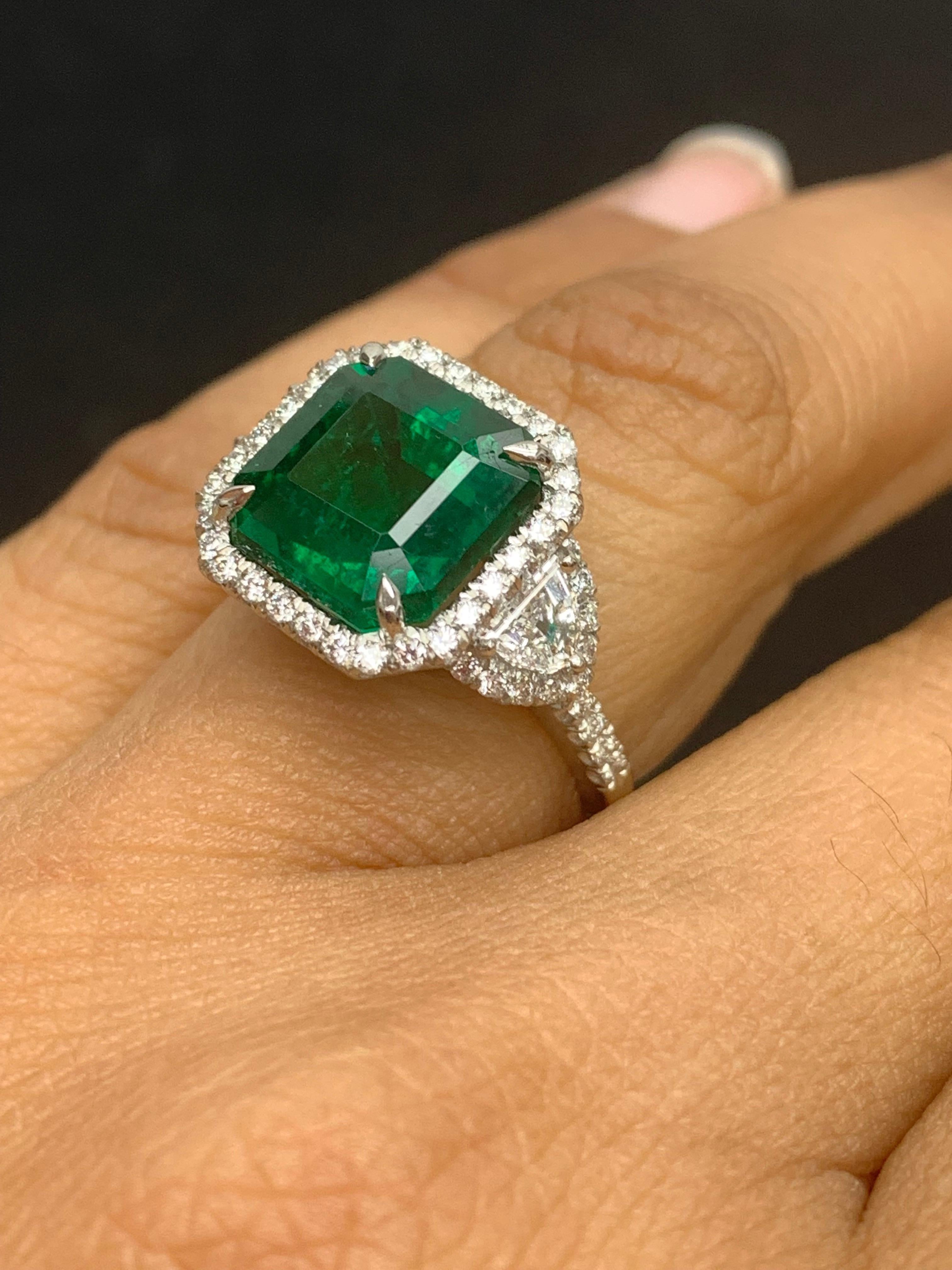 Certified 5.23 Carat Emerald Cut Emerald Diamond 3 Stone Halo Ring in Platinum In New Condition For Sale In NEW YORK, NY