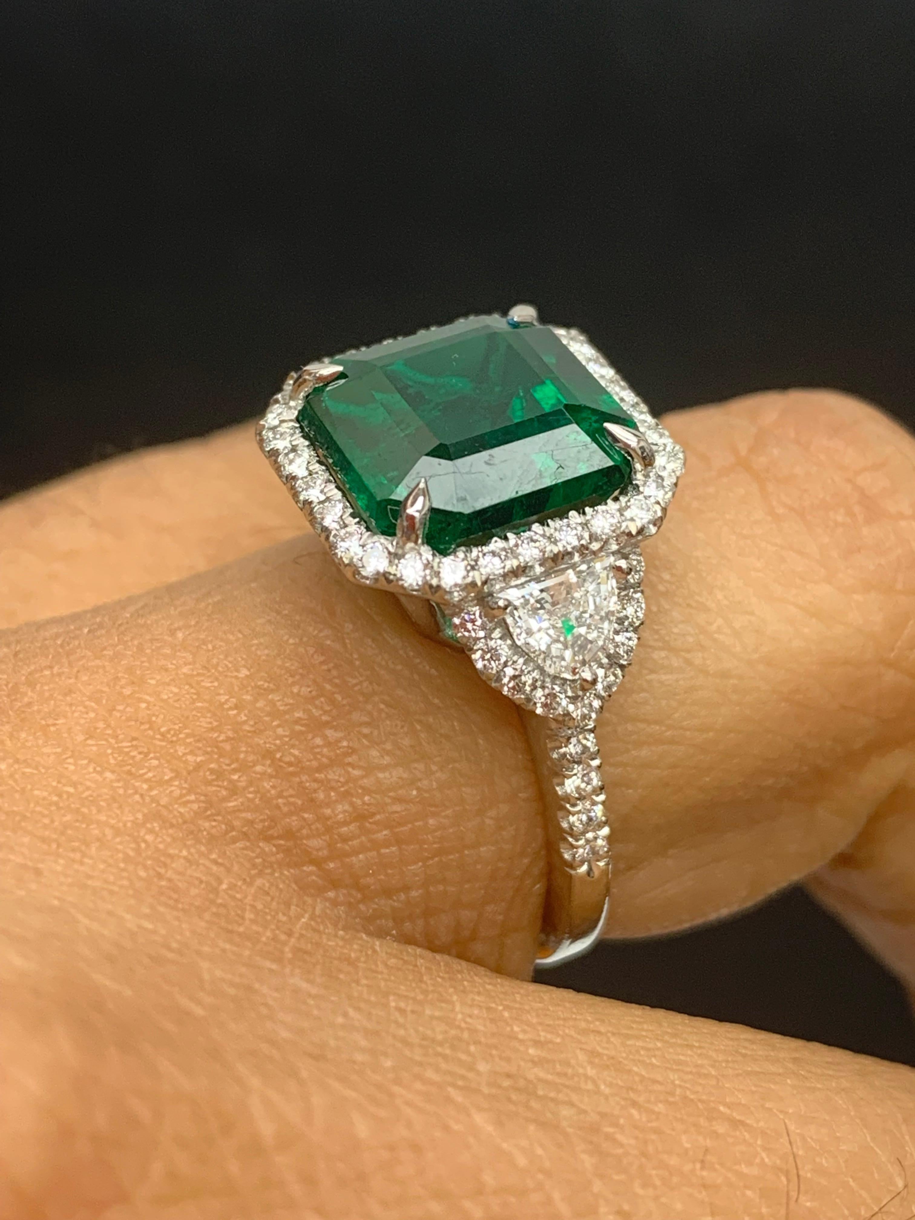 Women's Certified 5.23 Carat Emerald Cut Emerald Diamond 3 Stone Halo Ring in Platinum For Sale