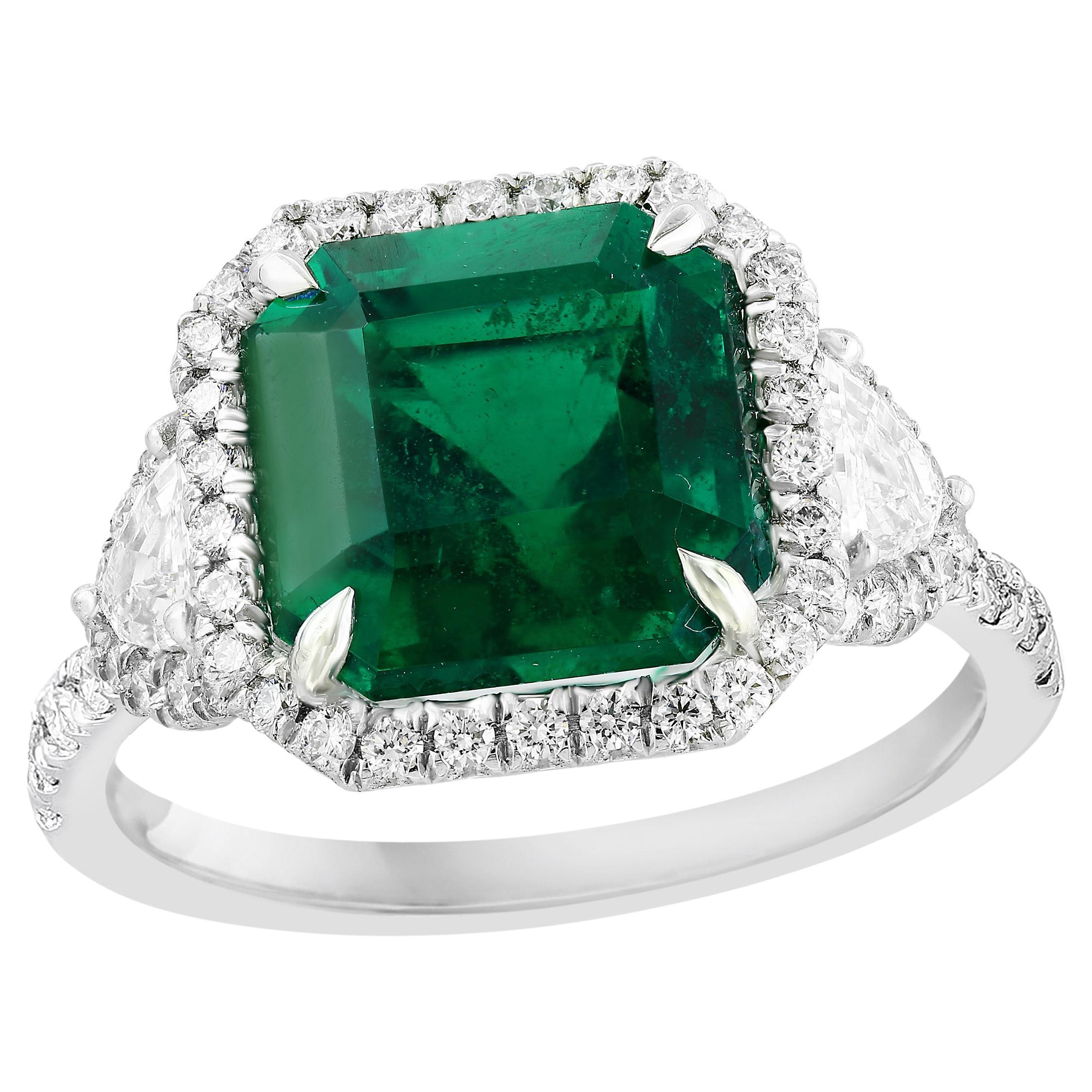 Certified 5.23 Carat Emerald Cut Emerald Diamond 3 Stone Halo Ring in Platinum For Sale