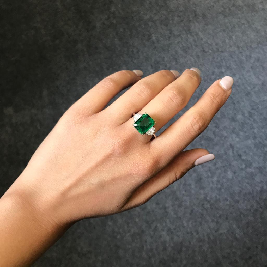 emerald cut with half moon side stones