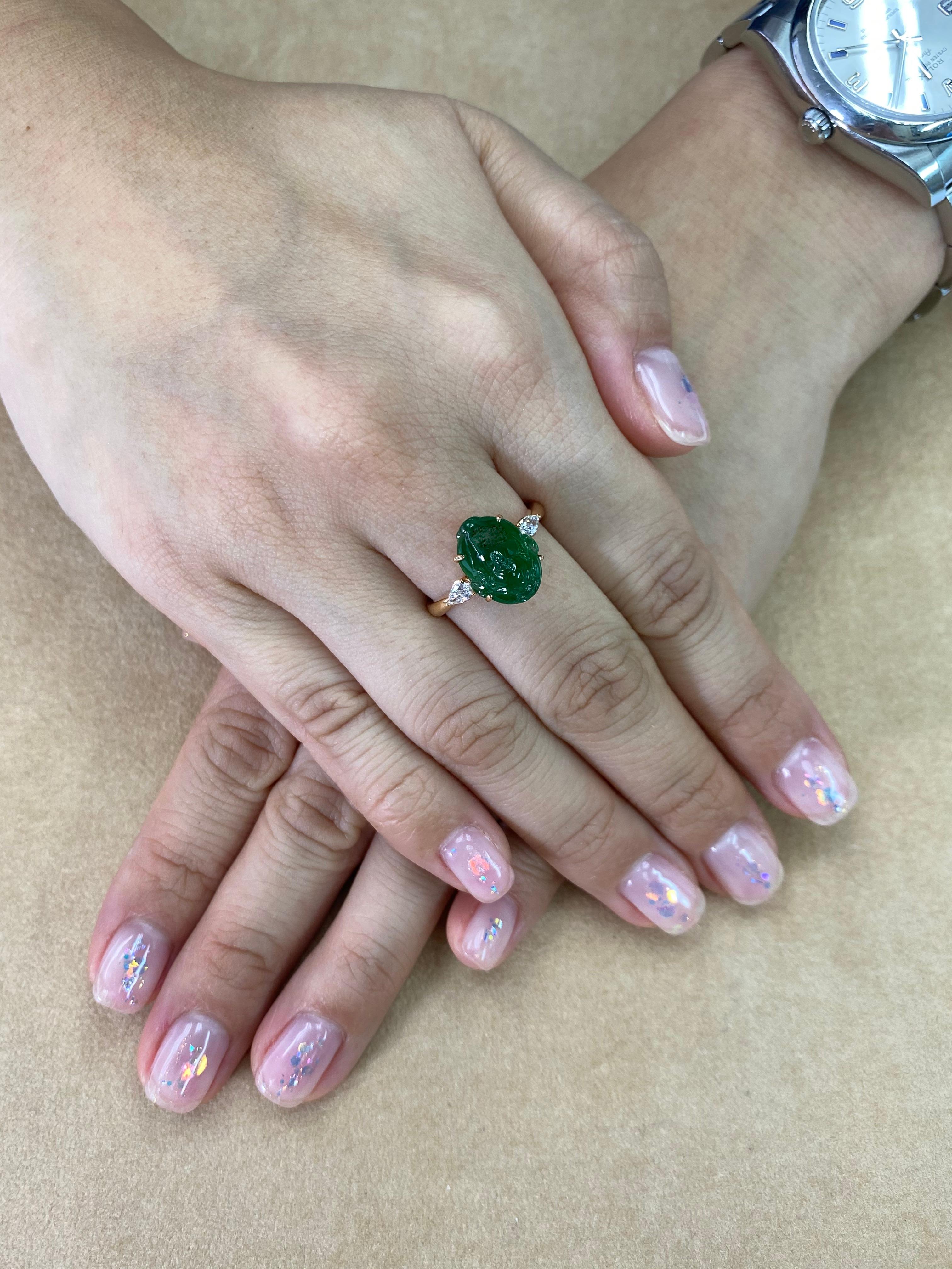 This ring has the best imperial green color, it GLOWS!  Here is an imperial green Jade and diamond ring. It is certified by 2 labs natural jadeite jade. The ring is set in 18k rose gold and diamonds. There are 2 pear shaped diamonds totaling 0.19