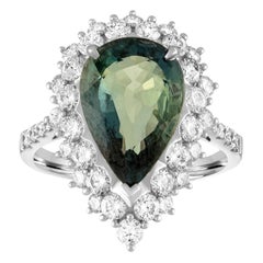 Bague en or avec saphir bleu verdâtre et diamant certifié 5,40 carats sans chaleur.