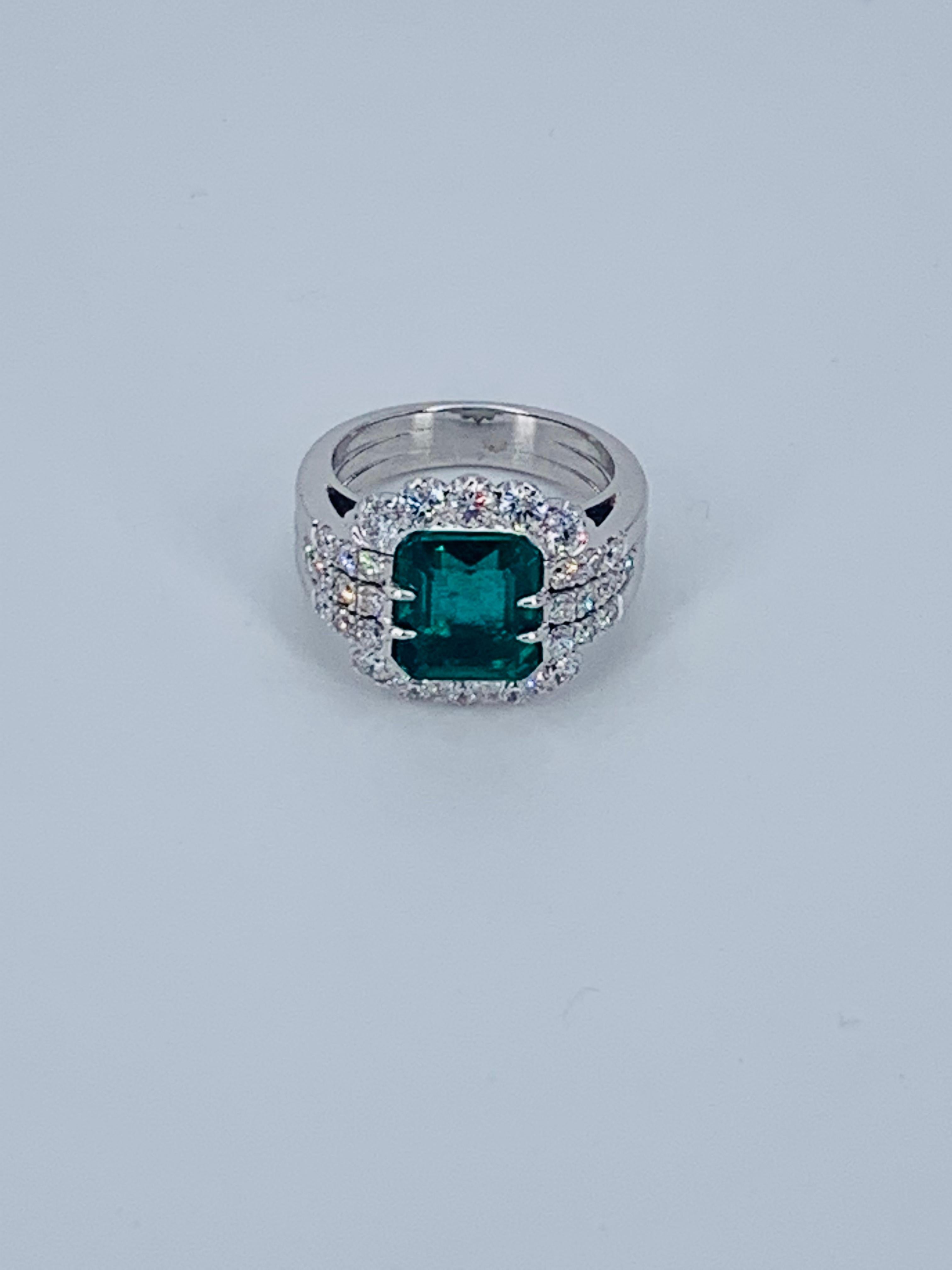 This beautiful Colombian Emerald Floral designed Diamond Halo cocktail ring, is truly stunning. Nestled amongst multiple Diamonds the Emerald is cushioned in the centre. 

The bright white natural Diamonds compliment the precious jewel and extend