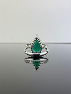 5.70 Carat Emerald and Diamond Three Stone Engagement Ring