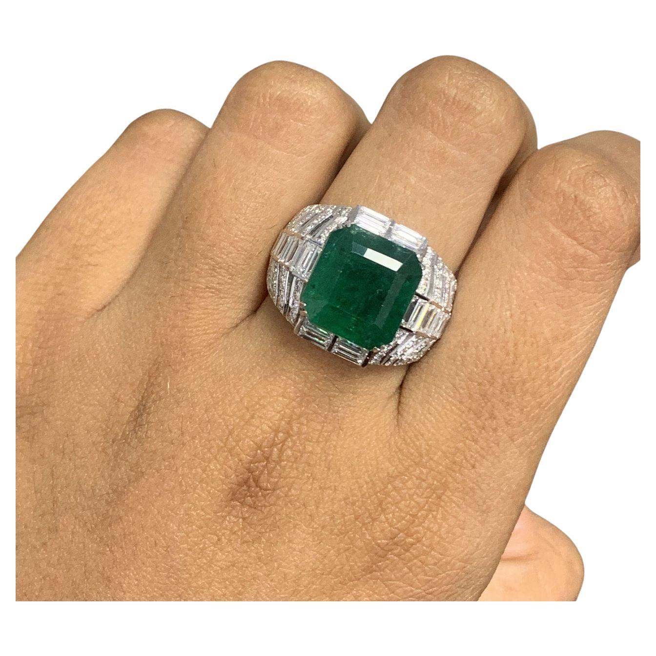 Prepare to be mesmerized by sheer elegance and sophistication. Behold the stunning Emerald & Baguette Diamond Ring, a testament to timeless beauty and impeccable craftsmanship.

Cut to close-up shots of the ring, highlighting the brilliance of the