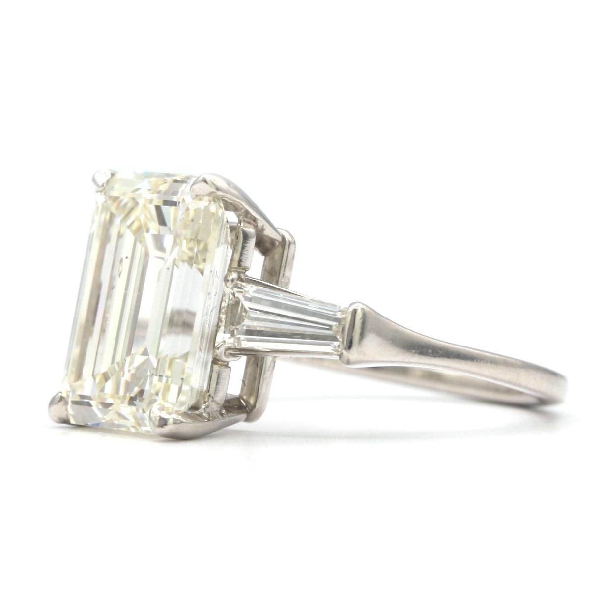 Stunning platinum ring with a 6.02ct Emerald cut I, SI1 White Diamond with E.G.L certificate.
The center diamond is flanked by 2 colorless baguette diamonds having a total weight of
0.50 carats.

Ring Size 6.5 (resizable)