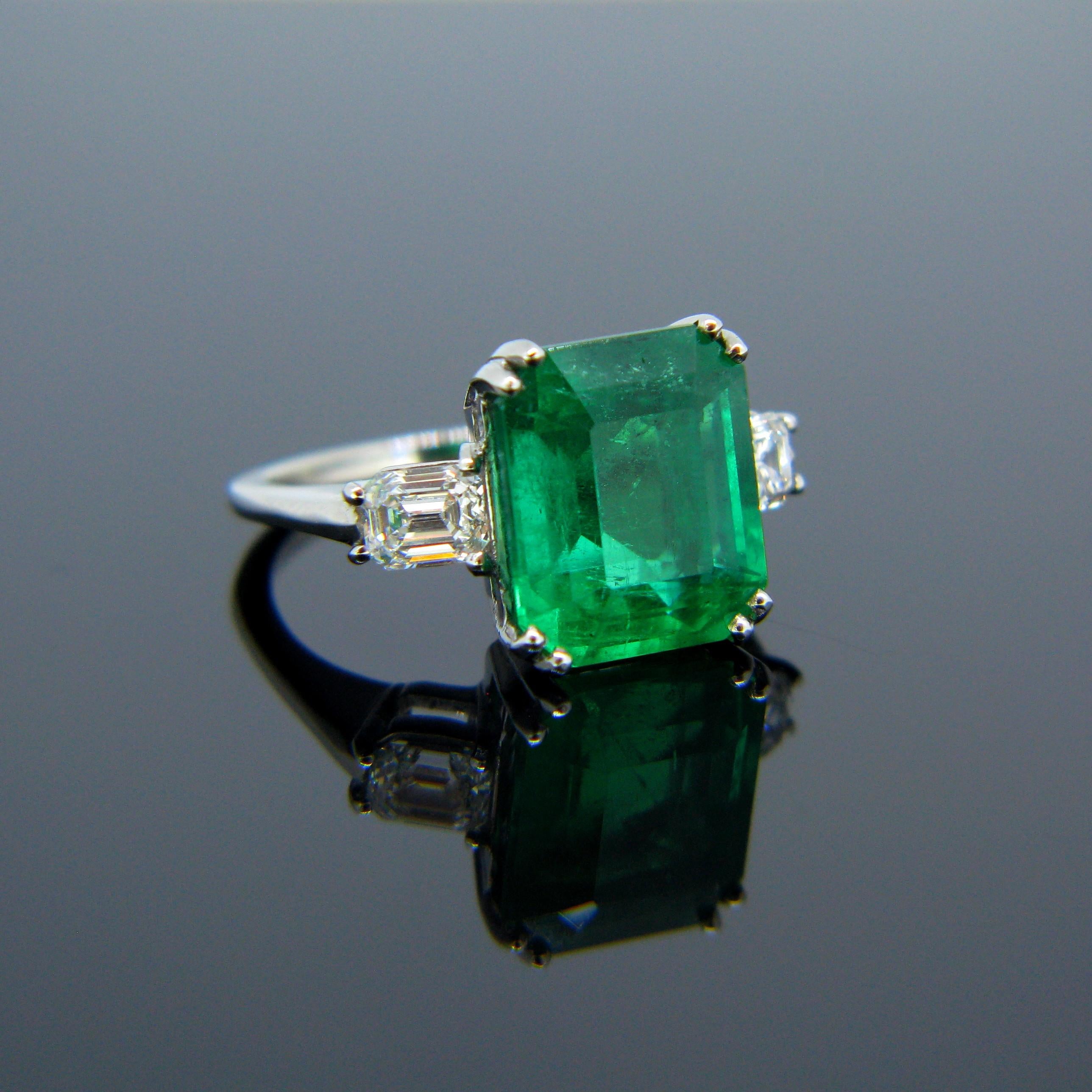 Modern Certified 6.05 Carat Colombian Emerald Diamond Emerald Cut Platinum Ring
