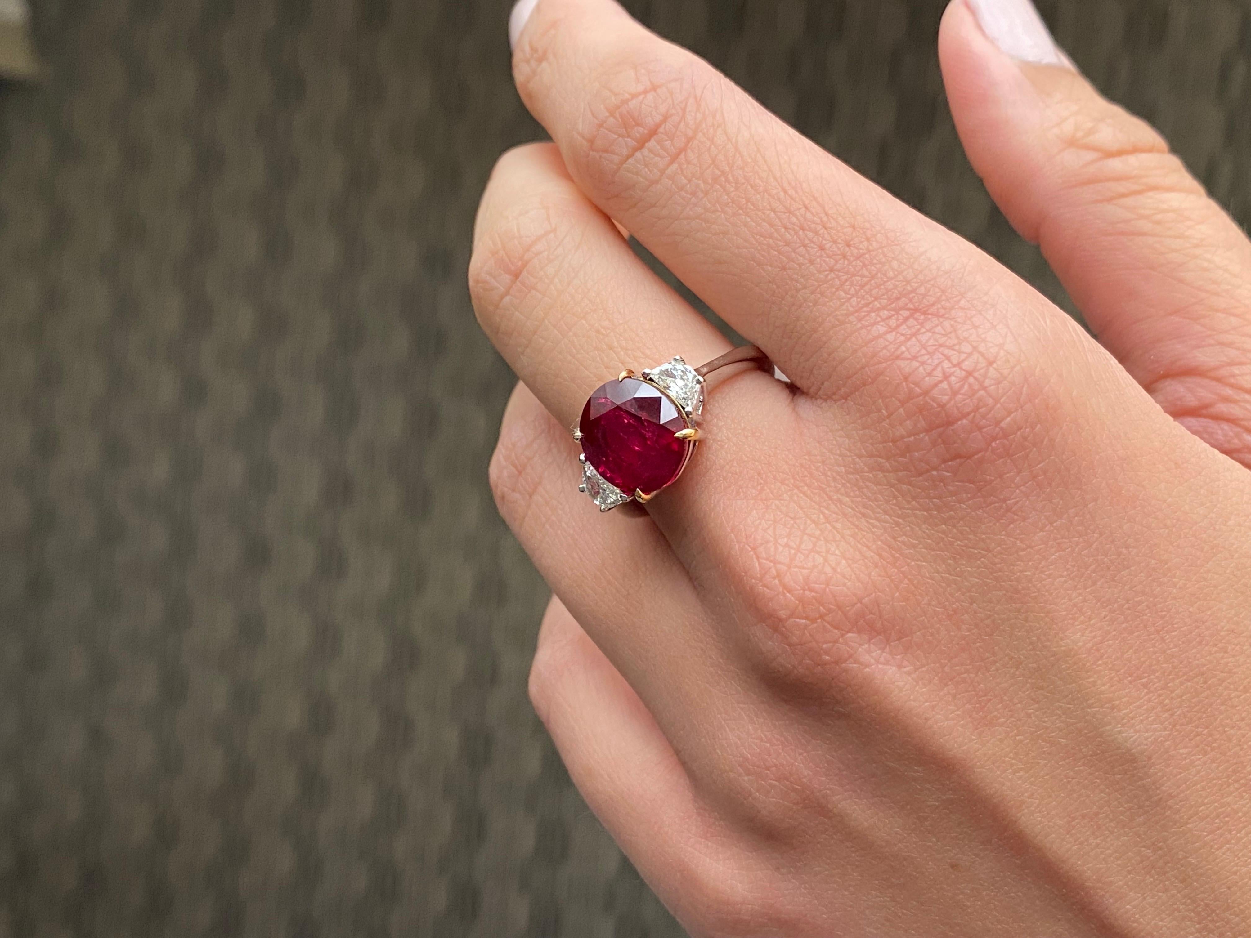 A stunning 6.22 Carat natural Ruby, with 0.38 Carat VS quality Diamond side stones. The center stone, natural Ruby, has a beautiful Pigeon Blood - vivid red color, which is considered the best color for Rubies. The stone is transparent, with very