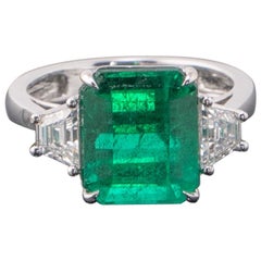 Certified 6.43 Carat Emerald and Diamond Three-Stone Engagement Ring