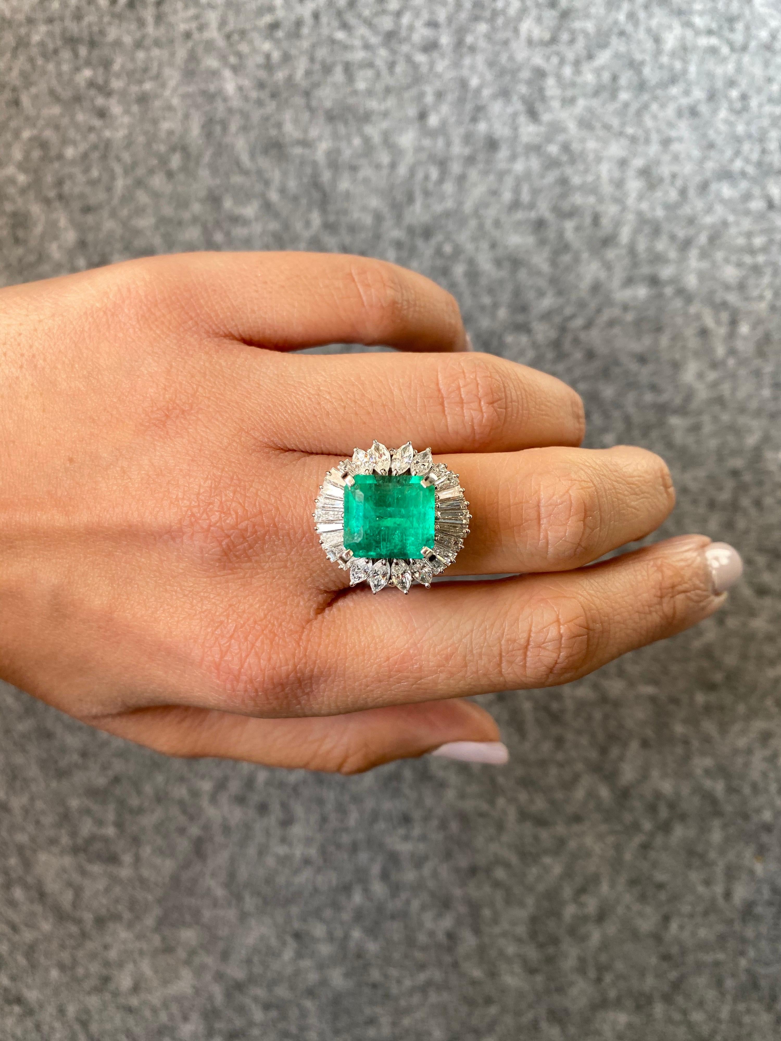 Beautiful art-deco certified 6.85 Colombian Emerald surrounded by colorless, VS quality Diamond baguettes and marquise cocktail ring, all set in solid 14.30 grams Platinum. Currently sized US 6, but can be altered.
Free shipping provided, and we
