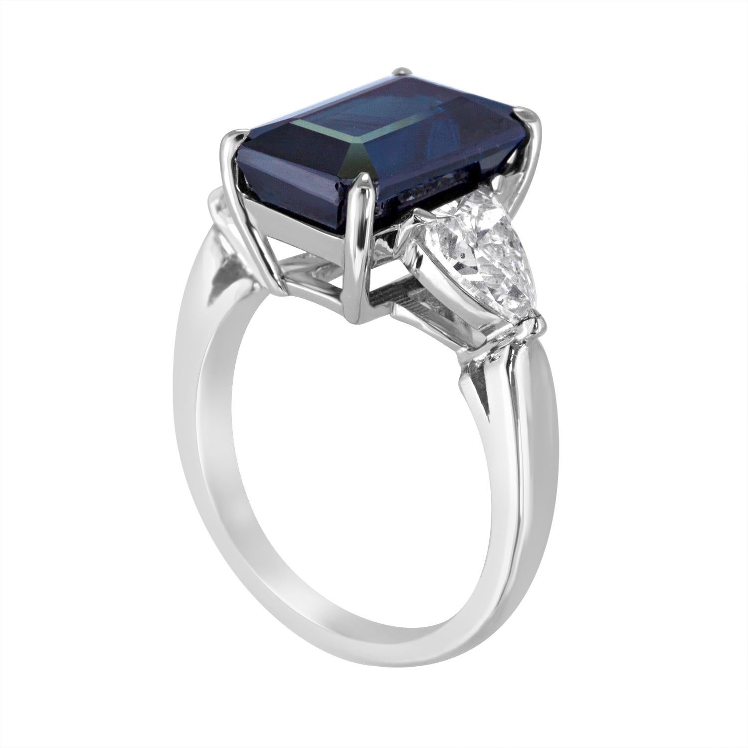 Beautiful 3 Stone Sapphire Ring.
The ring is 18K White Gold.
There are 1.22 Carats in Diamonds G SI, bullet shape.
The center stone is a 7.48 Carats Natural Greenish Blue Sapphire.
The Sapphire is Octagon Step Cut and NO Heat.
The Sapphire is