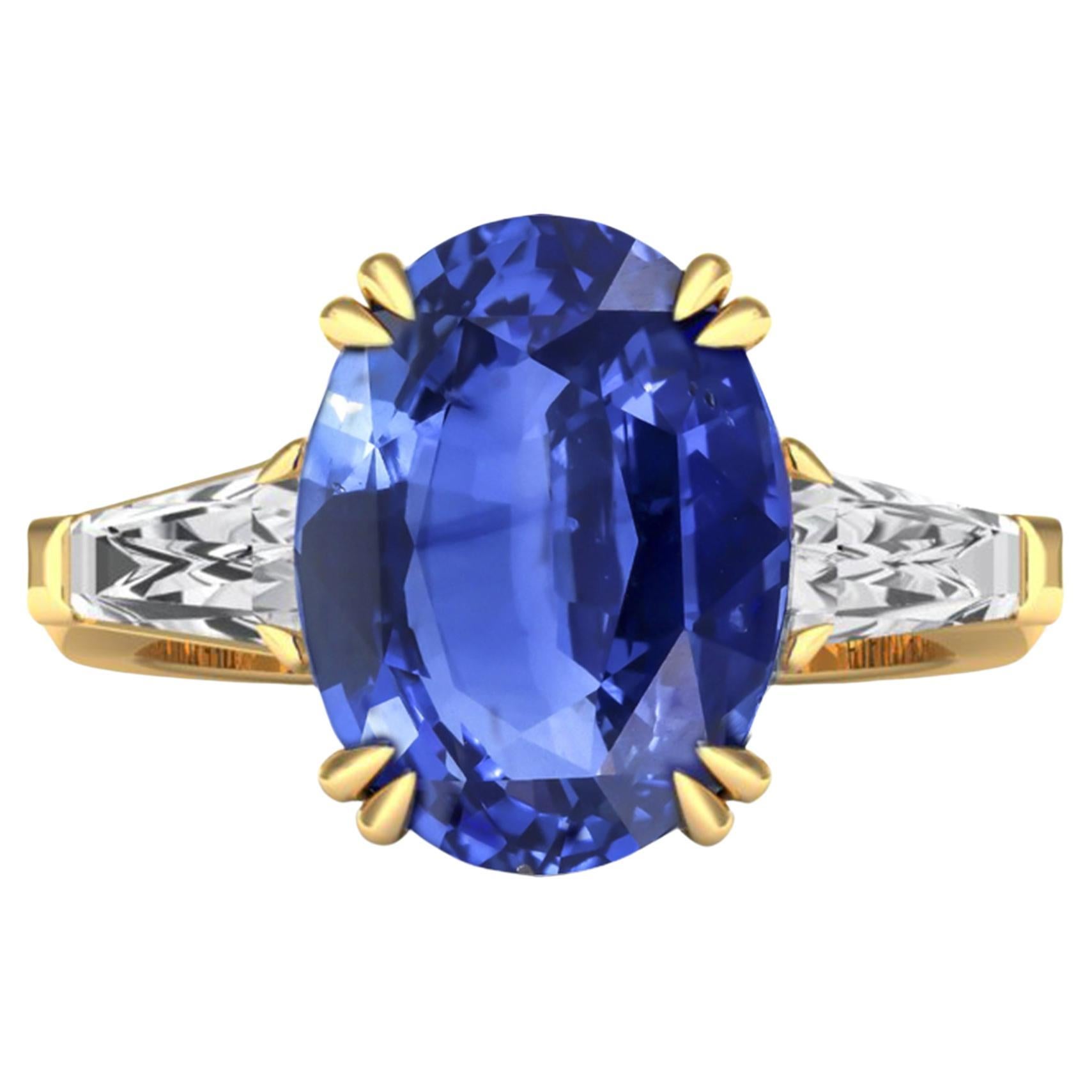 Gemstone: natural untreated, Ceylon Blue Sapphire
AAAA highest heirloom quality 
Weight of Sapphire : 7.5 carats 
Colour Grading: Cornflower Blue 
Conflict free diamonds x 2 
Metal: 18K Gold 
Certificate: Antwerp Laboratory for Gemstone Testing