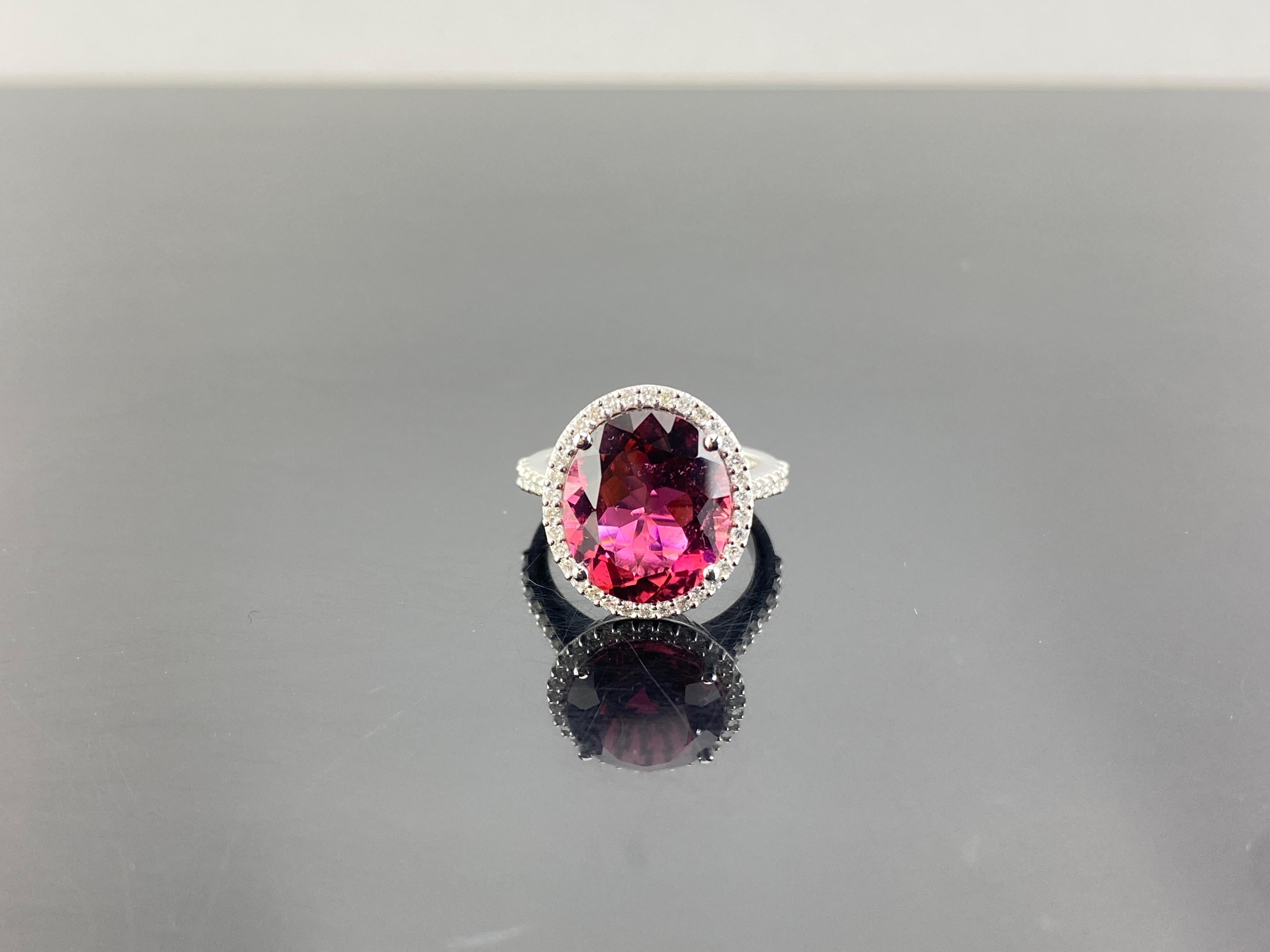With its striking symmetry and enchanting hue, our 7.87 carat Rubelite is a masterpiece of nature. With a rich, beautifully saturated pink color and exquisite transparency, this incredible rarity is showcased in a classic setting, surrounded by 0.57