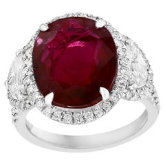 Certified 8.02 Carat Oval Cut Ruby and Diamond Three-Stone Halo Ring in Platinum