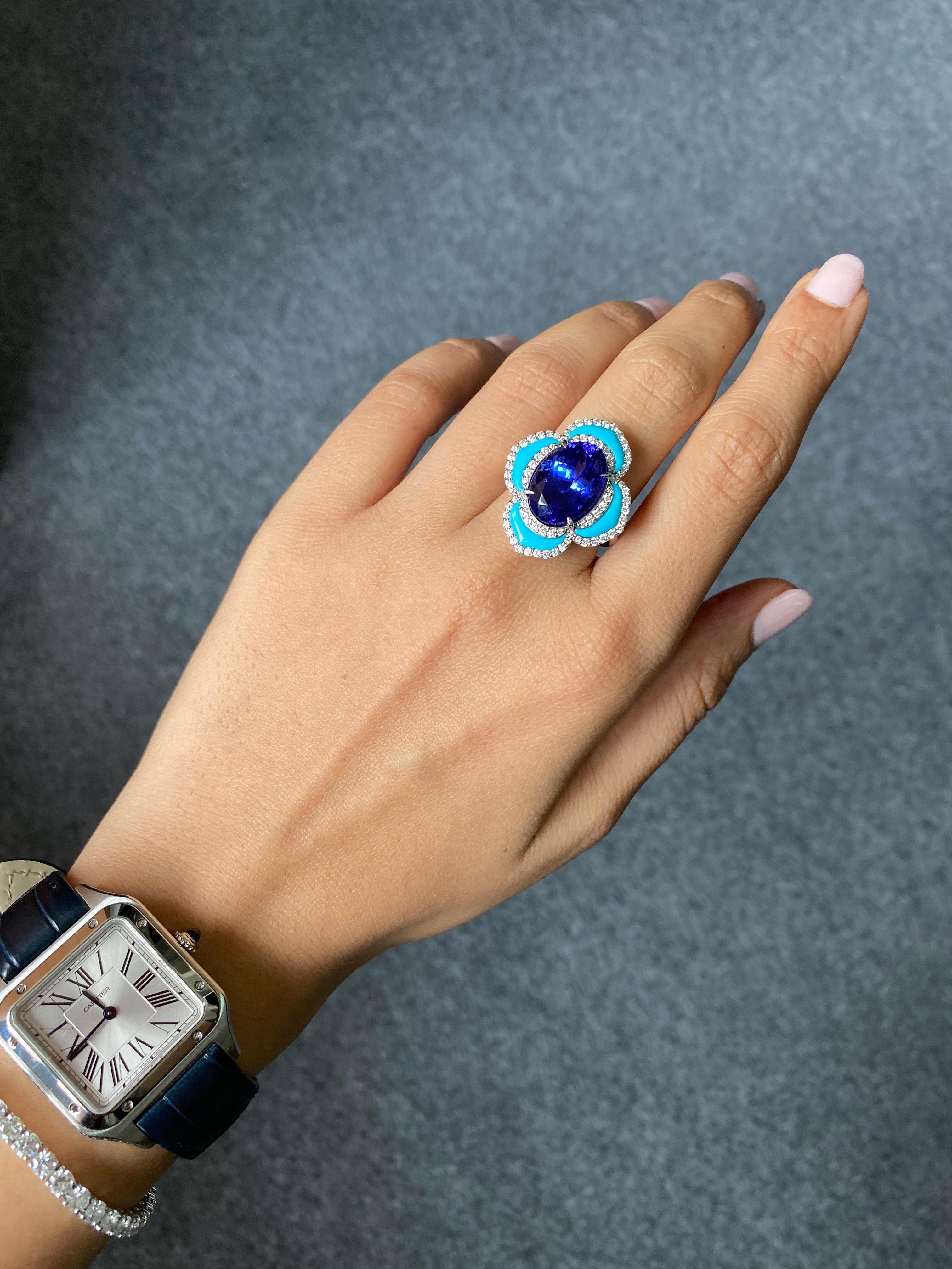 A very unique, one of a kind 8.16 carat Tanzanite, Turquoise and 0.7 carat VS quality White Diamond cocktail ring. The tanzanite is completely transparent, with no inclusions and great luster. 
Currently sized at US 7, can be altered. 
Free shipping