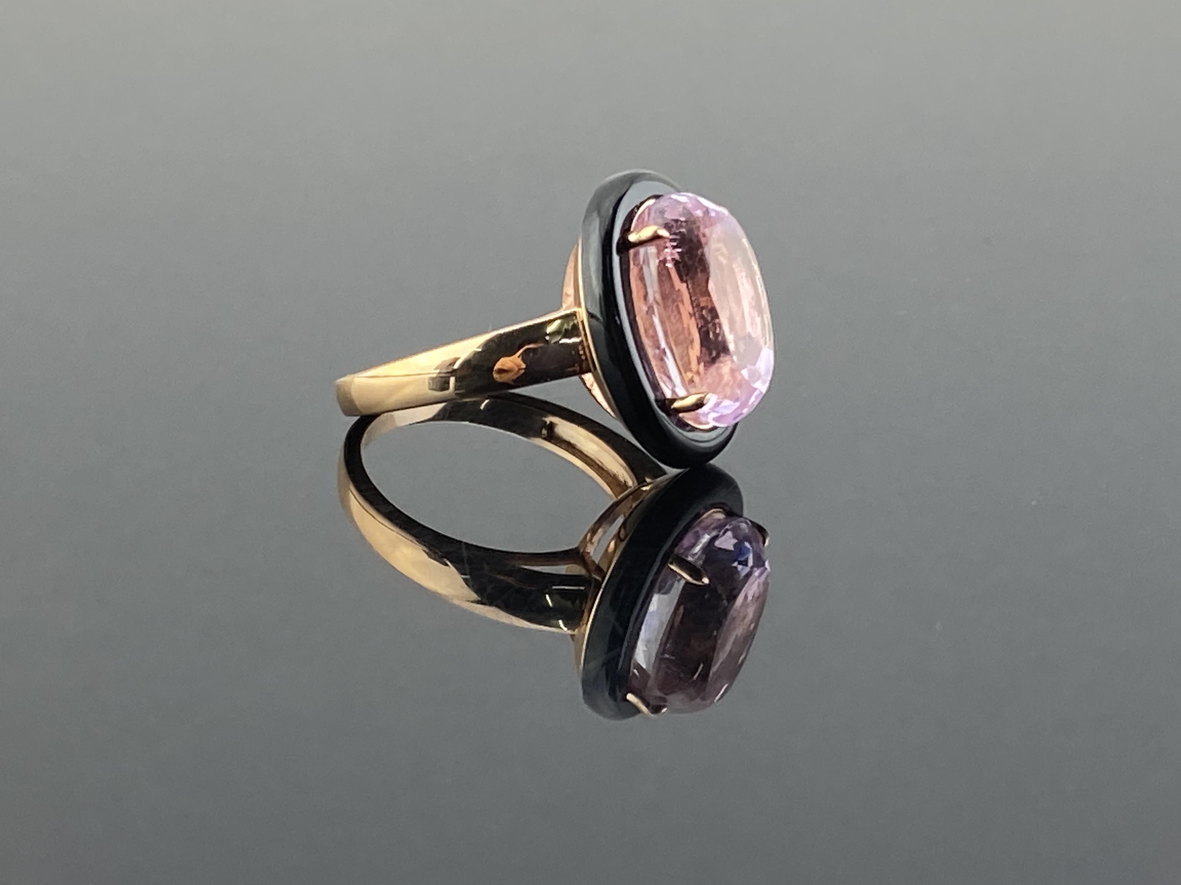 Beautifully crafted natural 8.30 carat Kunzite and Black Onyx ring, set in 18K Rose Gold.The combination of Rose Gold, Kunzite and Black Onyx gives the ring a very art-deco and unique look. The Morganite centre stone is clean, with no inclusions -