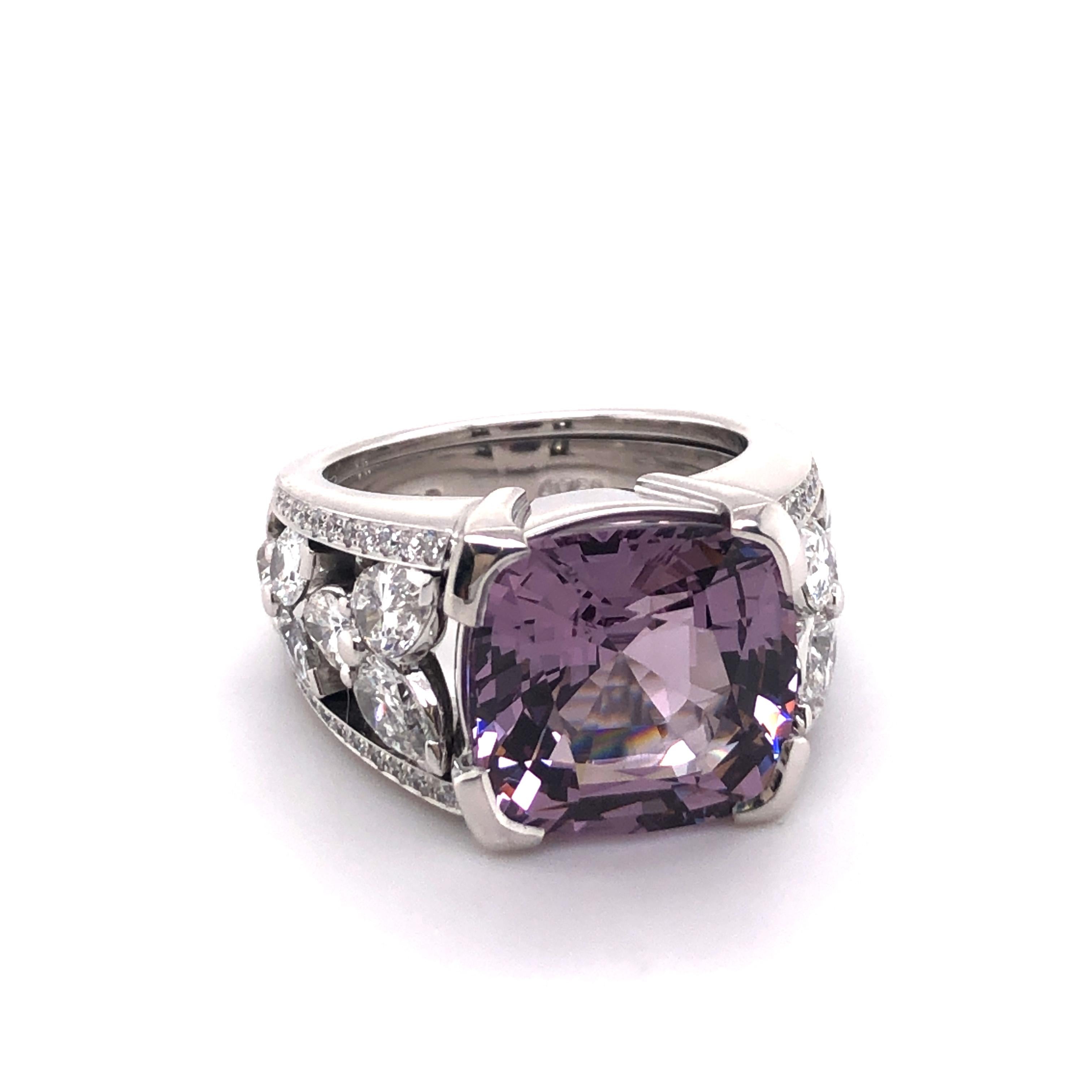This extraordinary ring in 18 karat white gold is set with a beautiful cushion-shaped violet Burmese spinel of 8.90 carats. The handcrafted mounting is signed Peclard and is set with 12 pear-shaped diamonds and 44 brilliant-cut diamonds of F/G