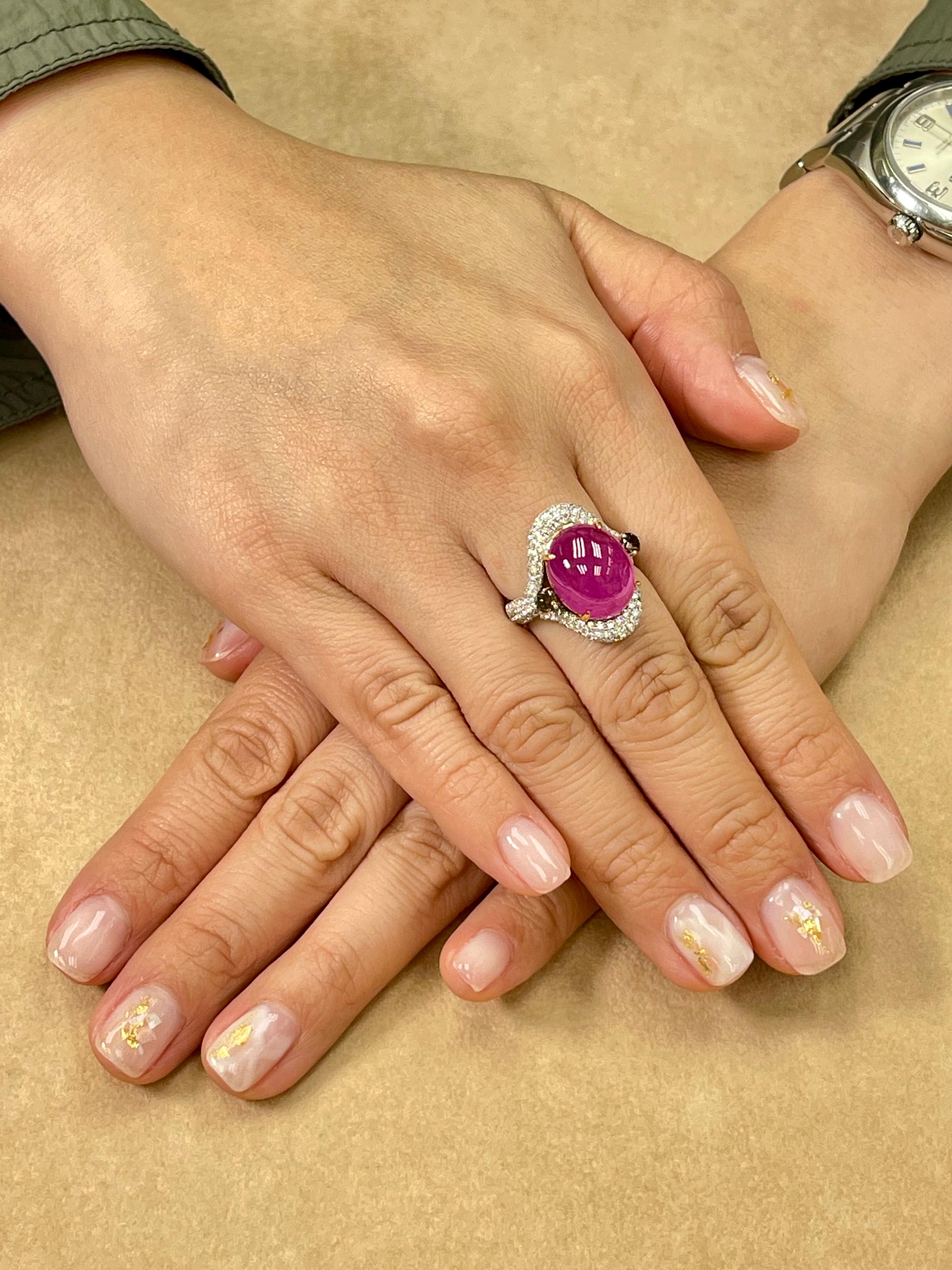 Please check out the HD video! Big statement piece. Here is a nice oversized pinkish red Ruby and diamond ring. The ring is set in 18k white gold and fancy cognac colored and white diamonds. The center pinkish red ruby cabochon is 9.08cts. There are