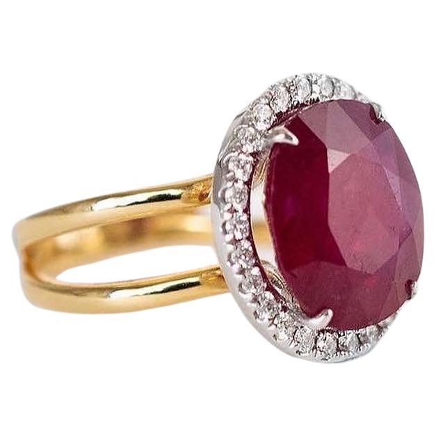 9 carat Ruby and Diamond ring. Handmade by Maadrn Fine Jewels in Toronto Canada. It is ‘one of a kind’ using recycled 14k yellow and white gold.  The Ruby was upcycled, and repolished along with the diamonds, making this a truly Eco-luxury ring. 