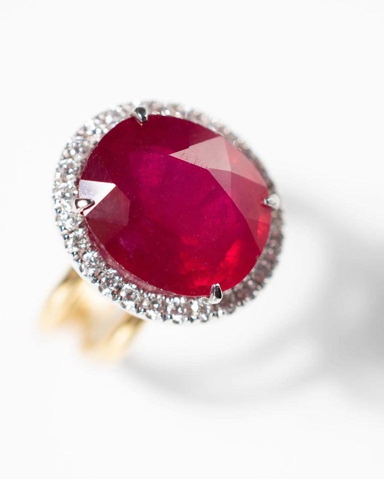 9 carat Ruby and Diamond ring. Handmade by Maadrn Fine Jewels in Toronto Canada. It is ‘one of a kind’ using recycled 14k yellow and white gold.  The Ruby was upcycled, and repolished along with the diamonds, making this a truly Eco-luxury ring.  It
