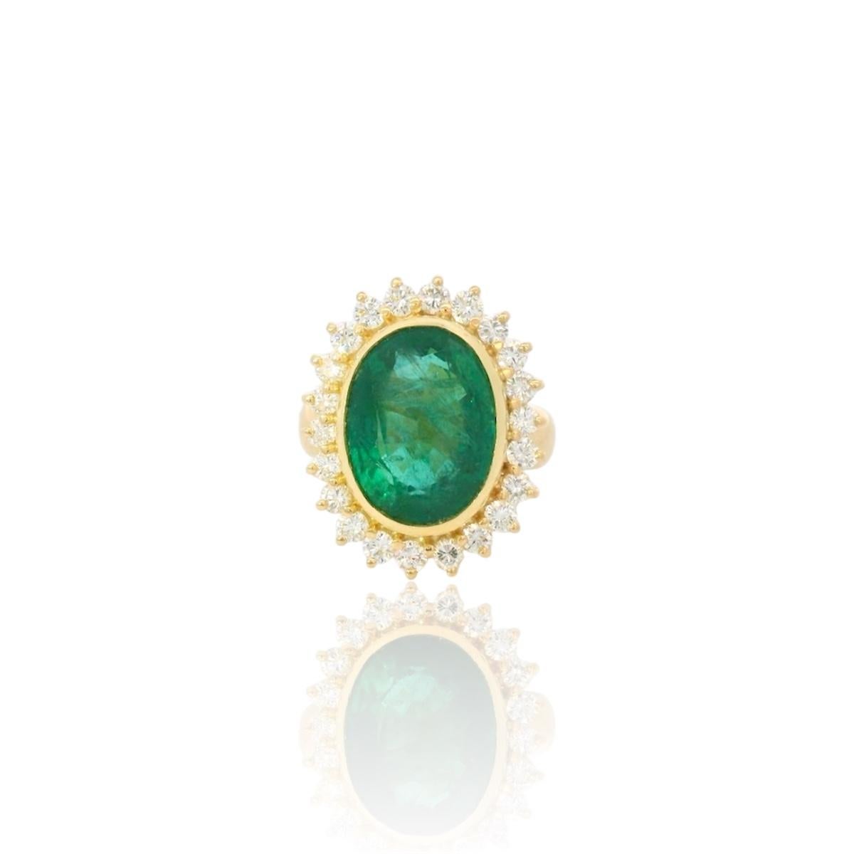 Vintage yellow gold 18K ring set with a center certified oval shape Zambian Emerald of 9.04 Carats and 22 brilliant diamonds for a total of approximately 0.70 Carats (estimated F/G color - Vs clarity). 
The diamonds are bright and lively.  

the