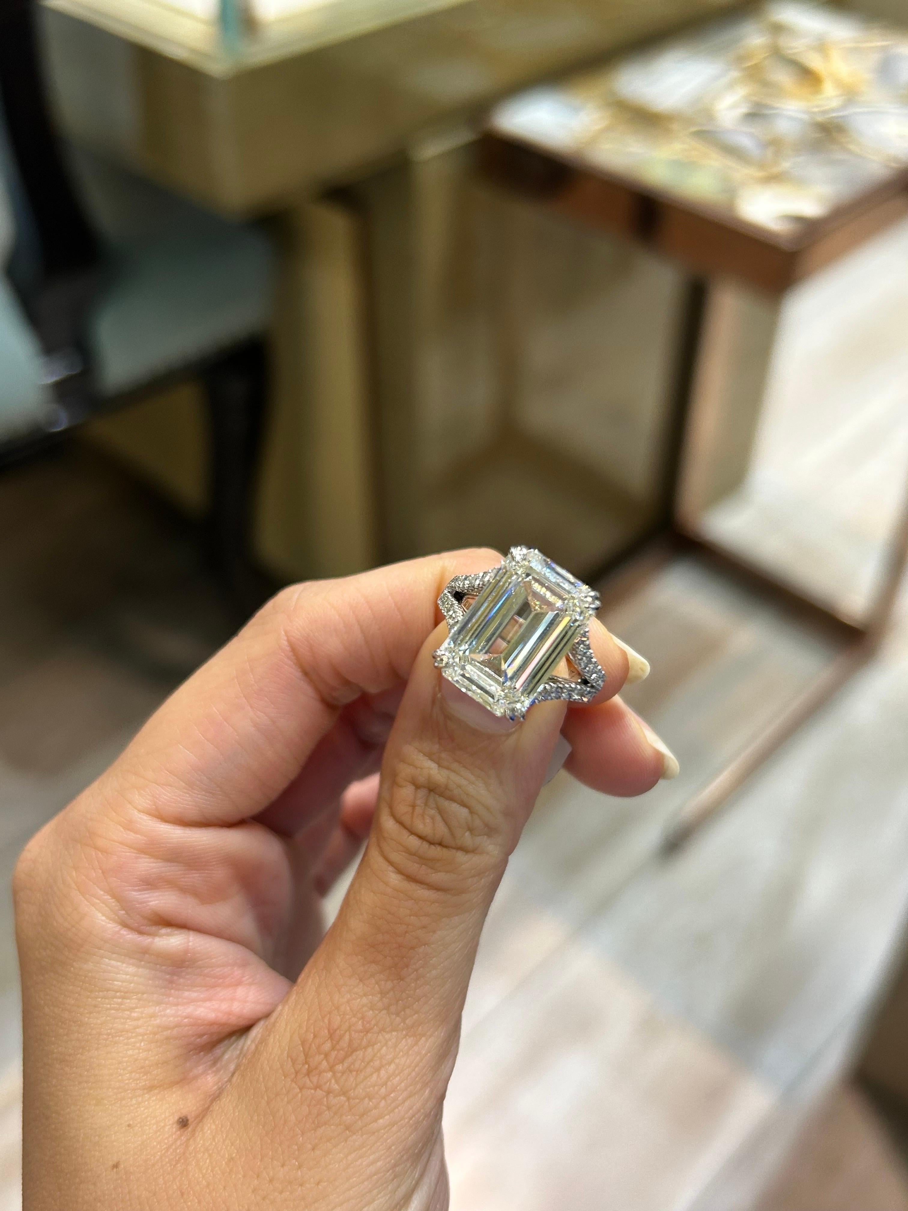 A breath-taking 9.40 carat emerald cut Diamond engagement ring, with a diamond studded band. The design can be customised.certificate available. The ring is currently sized at US 7, can be changed.  