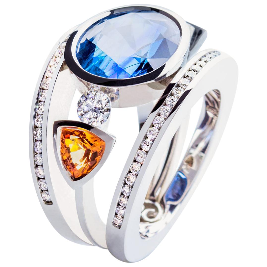 Certified 9.45 Carat Intense Blue Sapphire 2 Orange Corunds and 56 Diamonds Ring For Sale