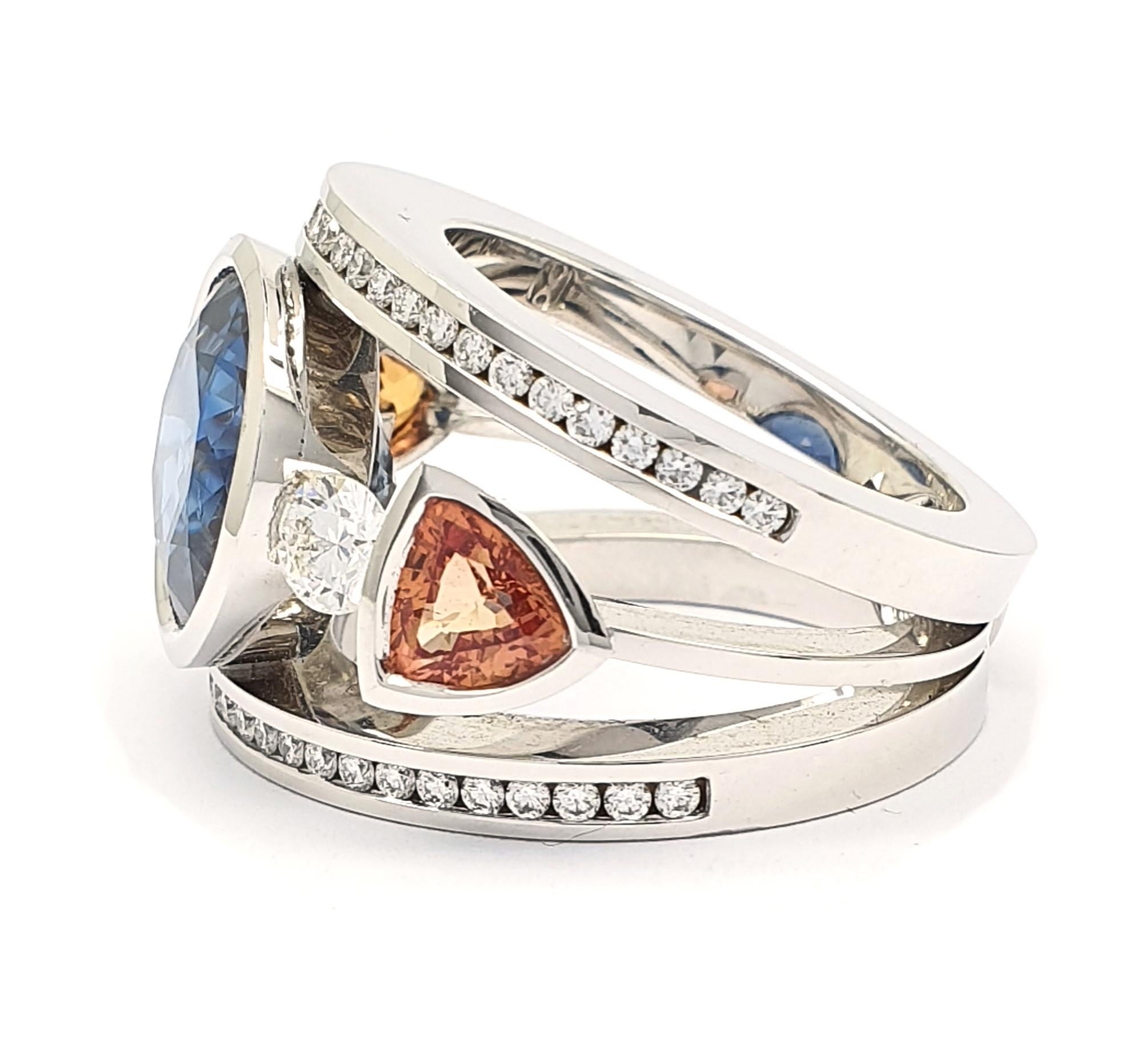 Modern Certified 9.45 Carat Intense Blue Sapphire 2 Orange Corunds and 56 Diamonds Ring For Sale