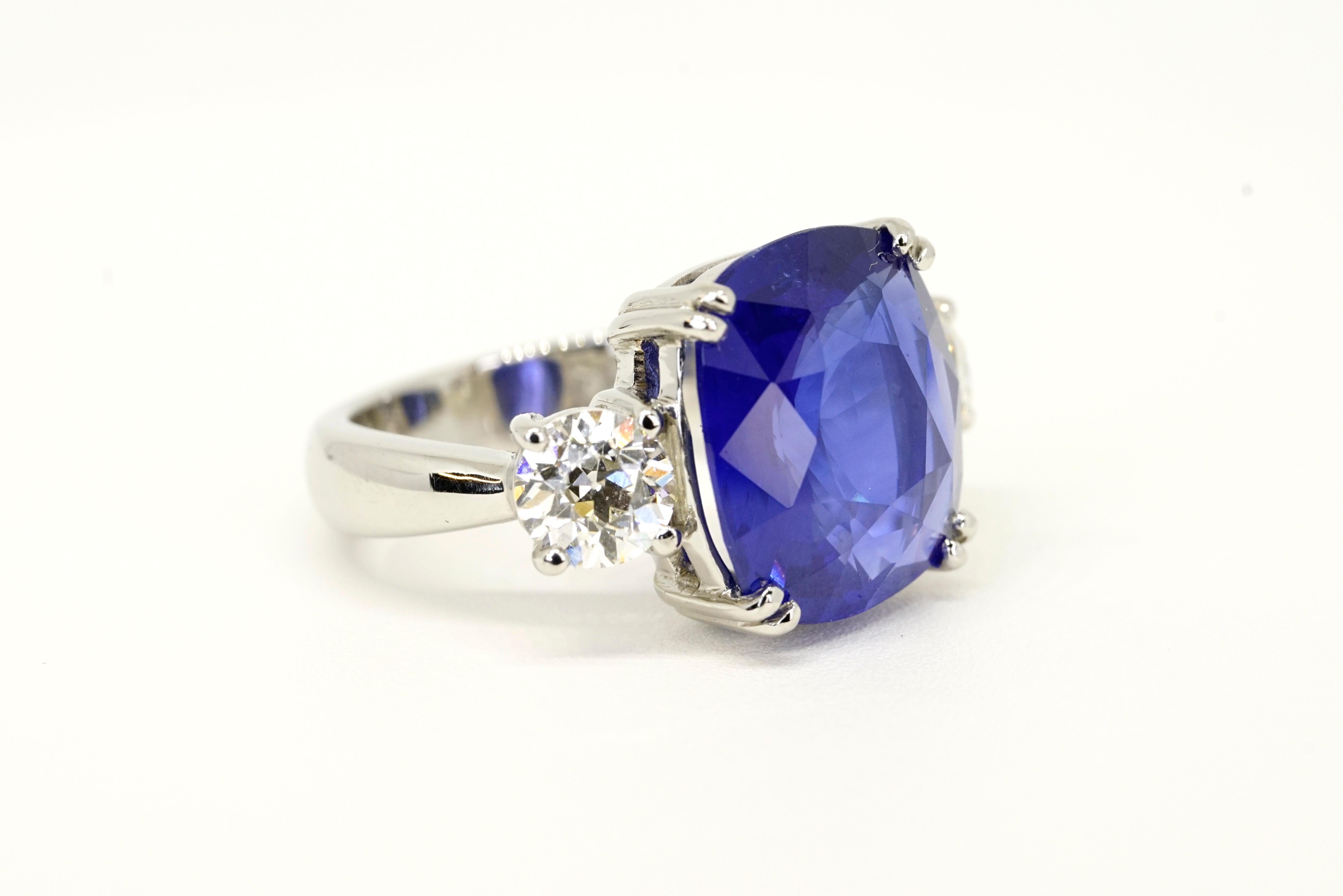 Extravagant 9.67 Carats Natural Ceylon Sapphire Antique Cushion (extremely well cut) Set in Platinum three stone ring, this Ceylon sapphire is a deeper blue than most traditional Ceylon making it an extremely vibrant and lively - accompanied with