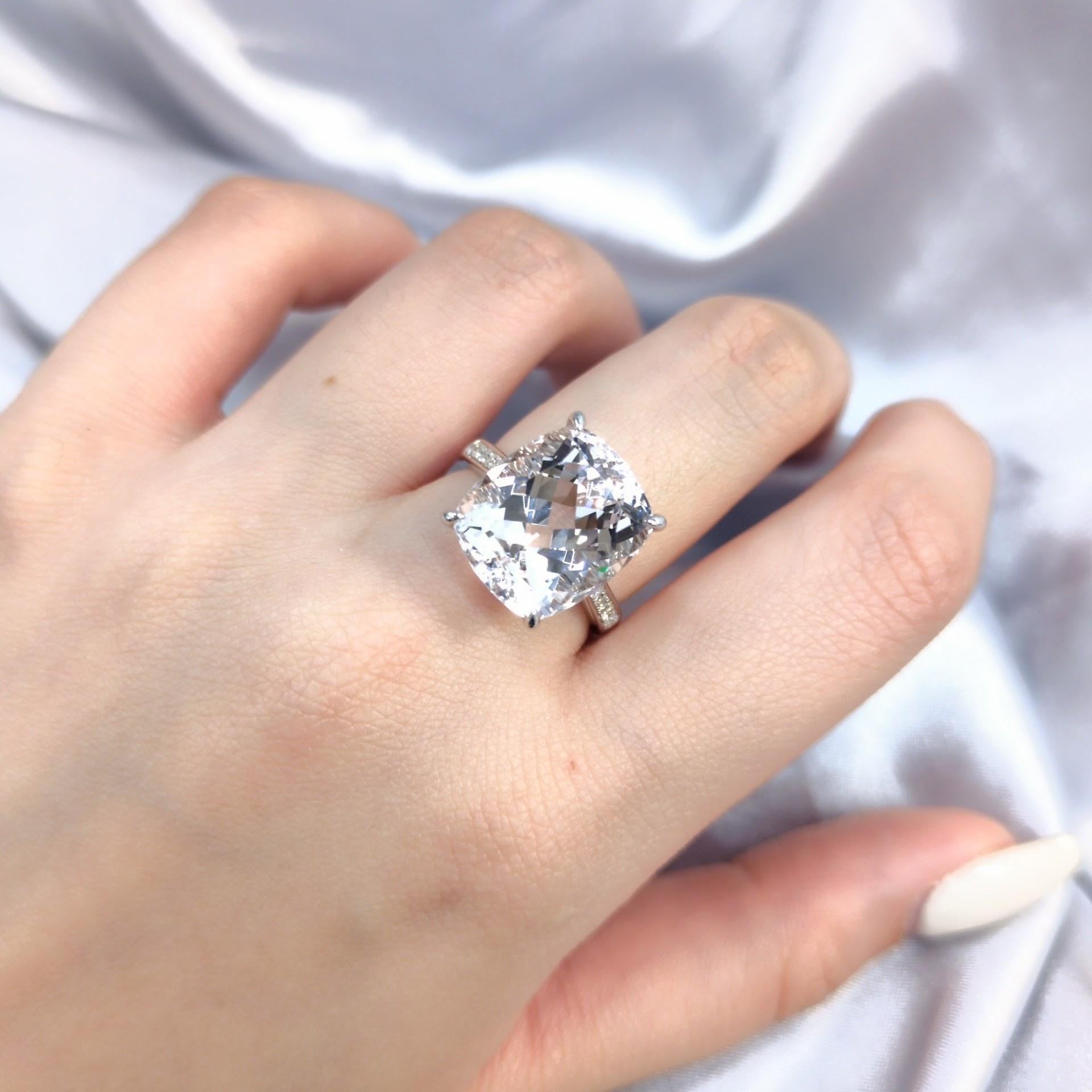 Imagine a ring that whispers of romance and radiates an inner glow. This is that ring.

At the heart of this masterpiece lies a breathtaking 9.70 carat Natural Morganite. Its soft, delicate pink hue, certified by GFCO Gem Lab as 