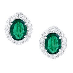 Certified 9.70 Carat Oval Cut Emerald and Diamond Halo Earrings in 18K WhiteGold