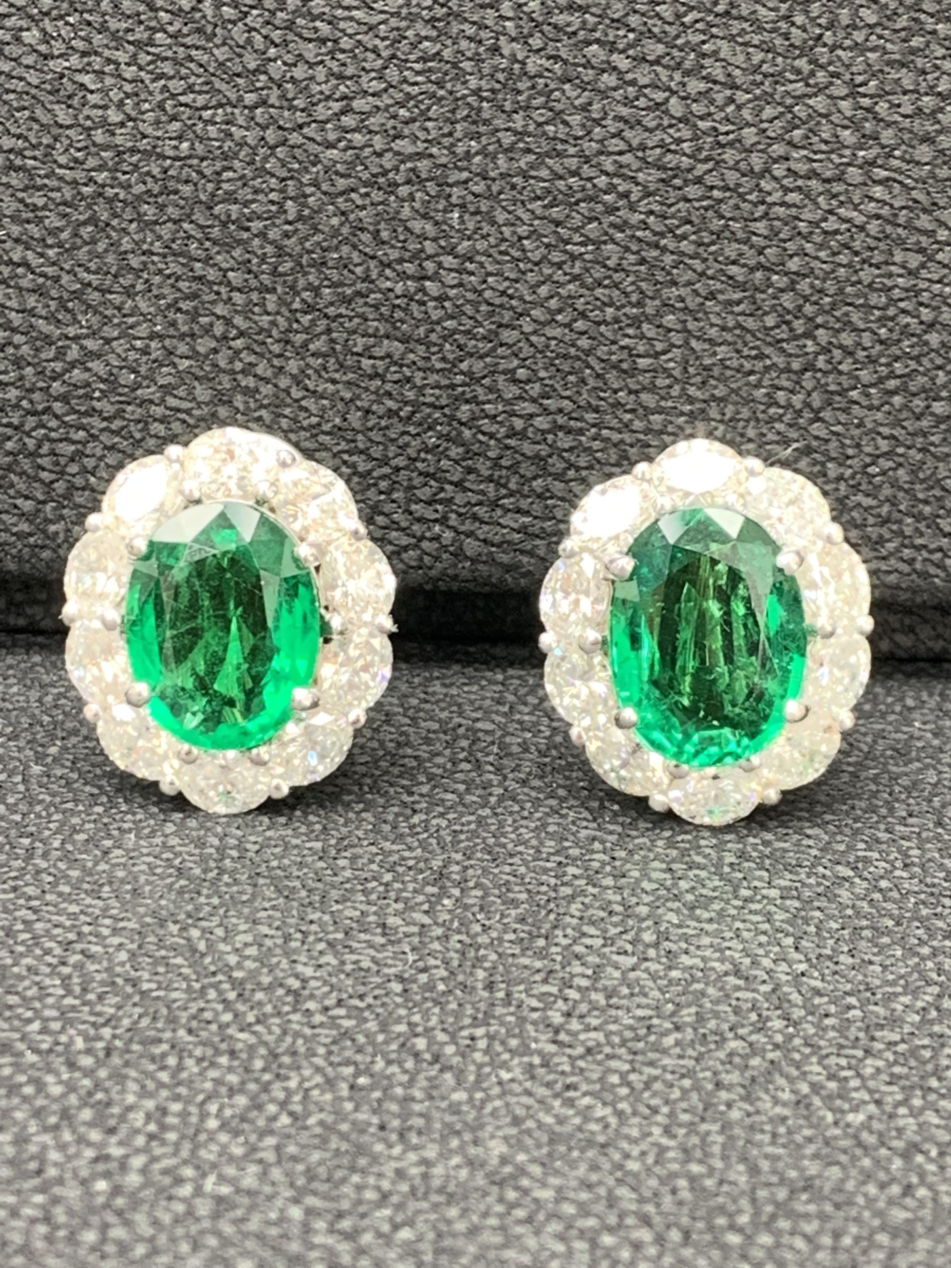 Certified 9.70 Carat Oval Cut Emerald and Diamond Halo Earrings in 18K WhiteGold For Sale 2
