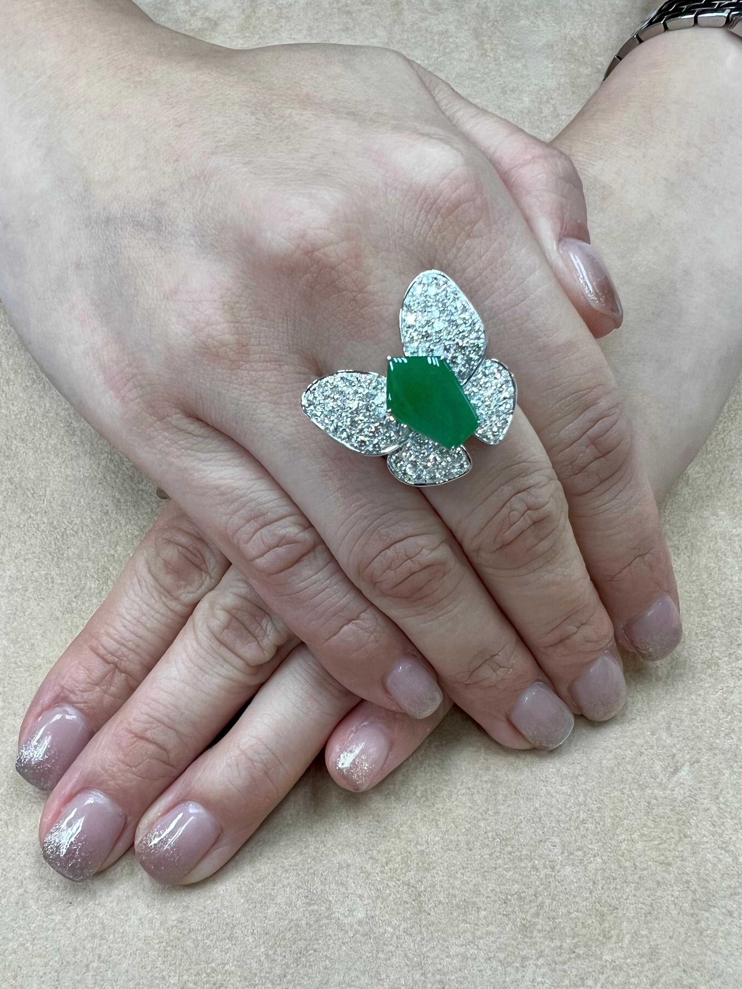 Please check out the HD video. This apple green jadeite jade butterfly ring is spectacular! It a big statement piece. This ring is certified natural jadeite jade (4.32cts) with no treatments or enhancements. The ring is set in 18k white gold. There