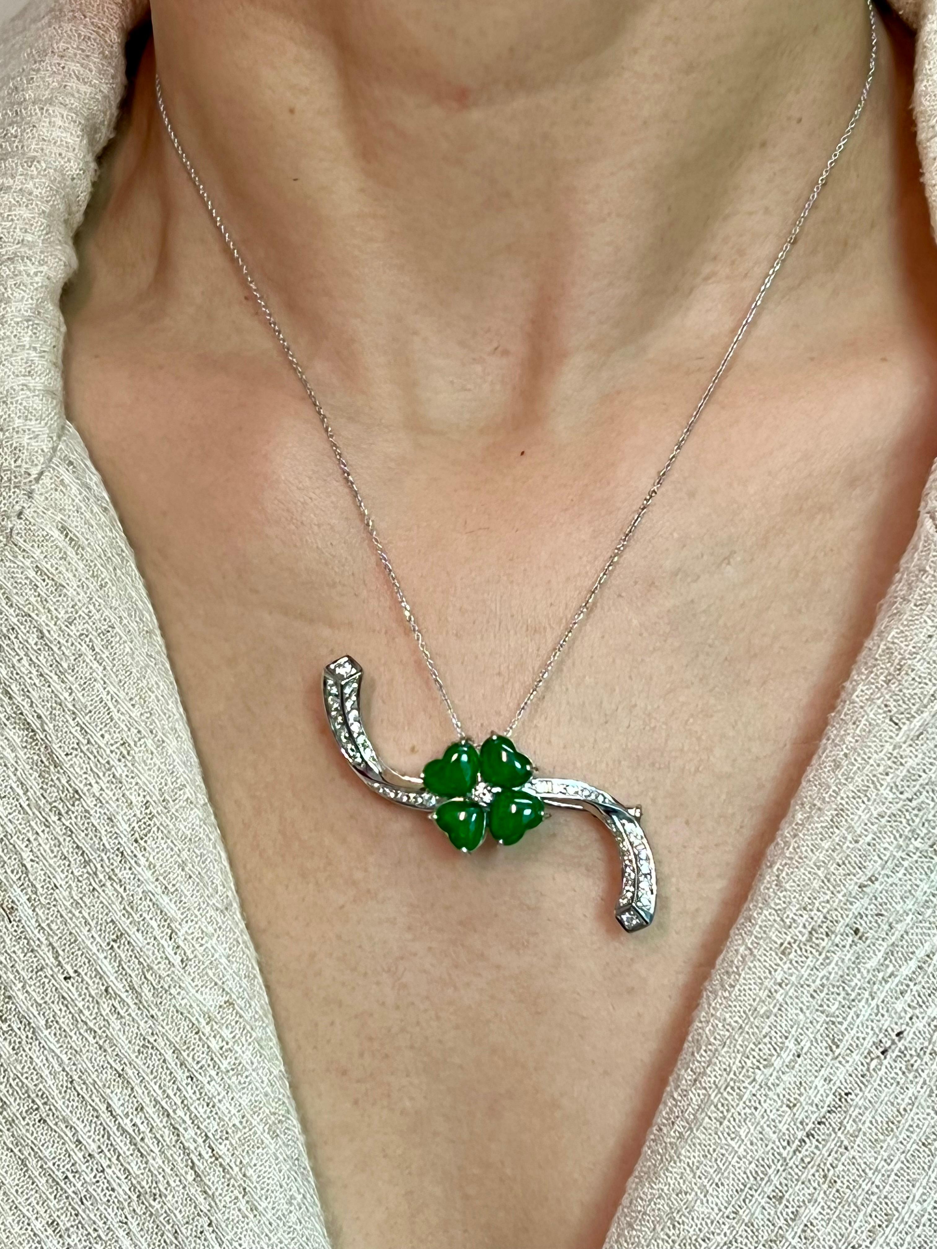 Please check out the HD video. This apple green jadeite jade four leaf clover pendant / brooch is very colorful and eye catching! This is certified to be natural jadeite jade. The pendant / brooch is set in 18k white gold. There are 4 heart shaped